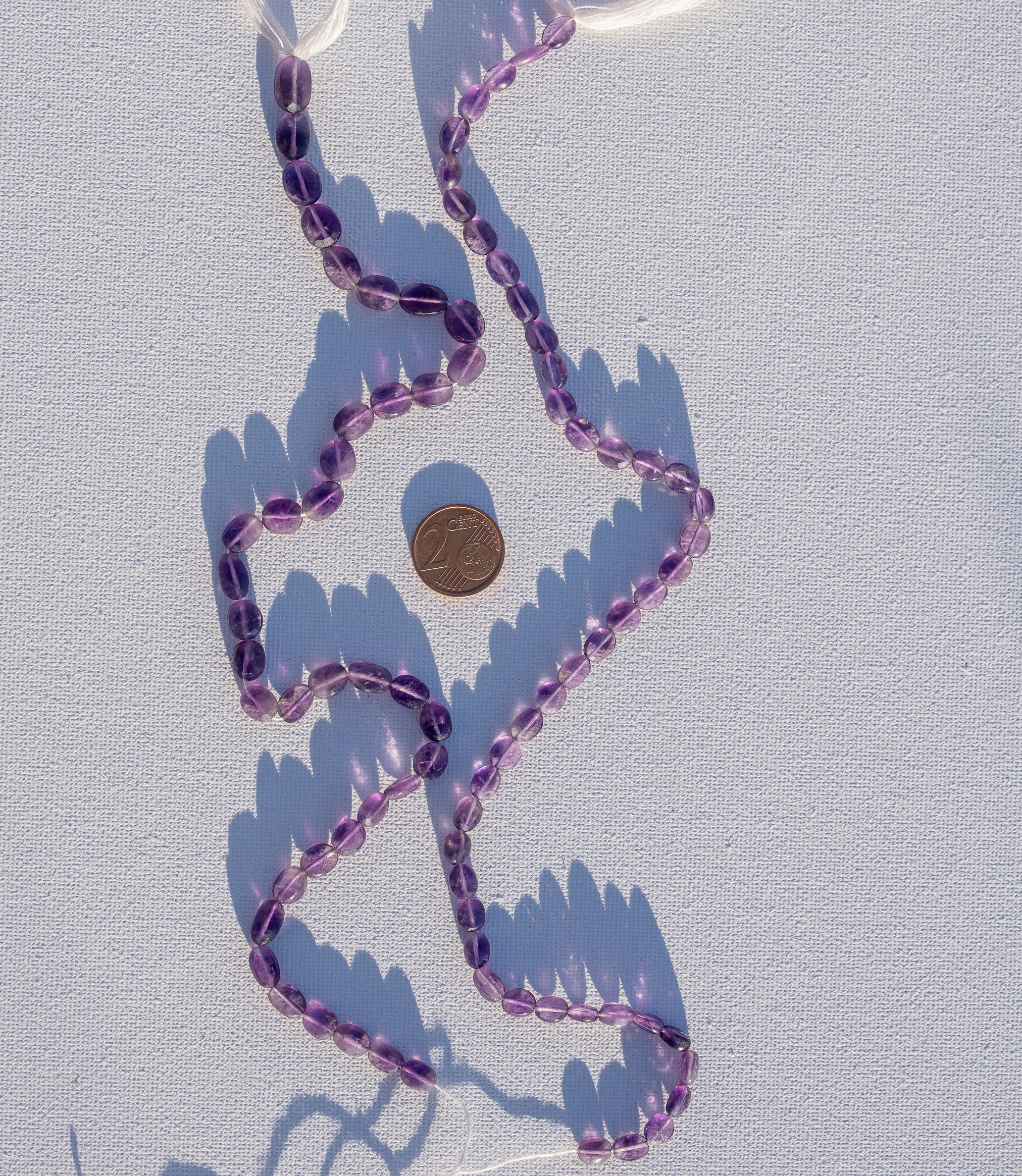 Fils de 31/32 cm de perles ovales facettes en Améthyste de env 7/11 mm