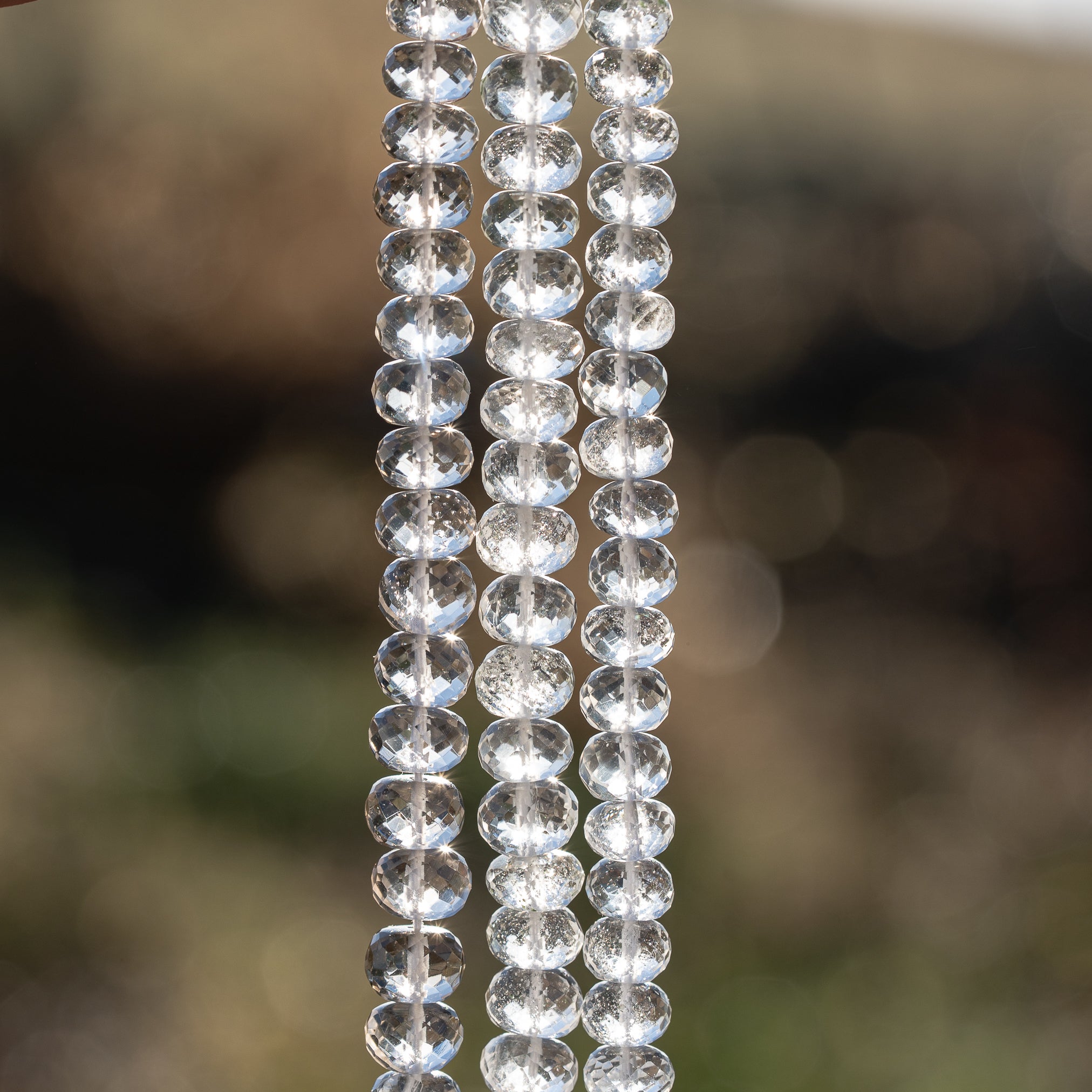 Fils de 20 cm de perles rondelles facettes de cristal de roche de env 7/8 mm
