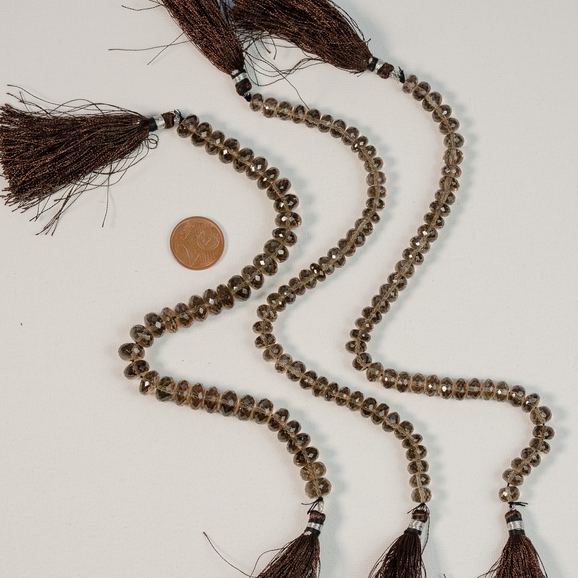 Fil de env 20 cm de perles rondelles facettes de quartz fumé de env 7,5 ou 9,5 mm