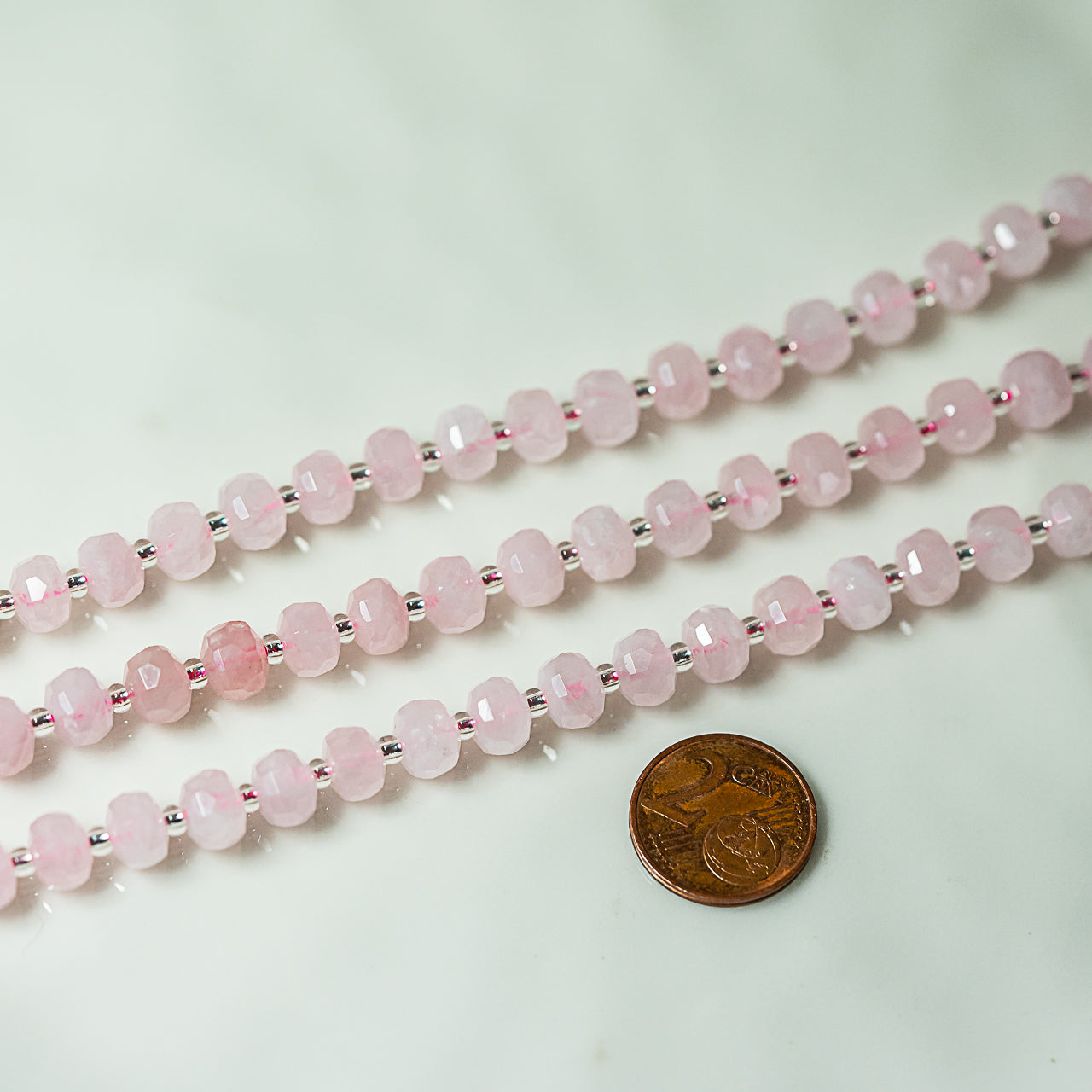 Perles rondelles facettes de Quartz rose de env 7,5 x 5 mm ( rang de env 26/27 perles )