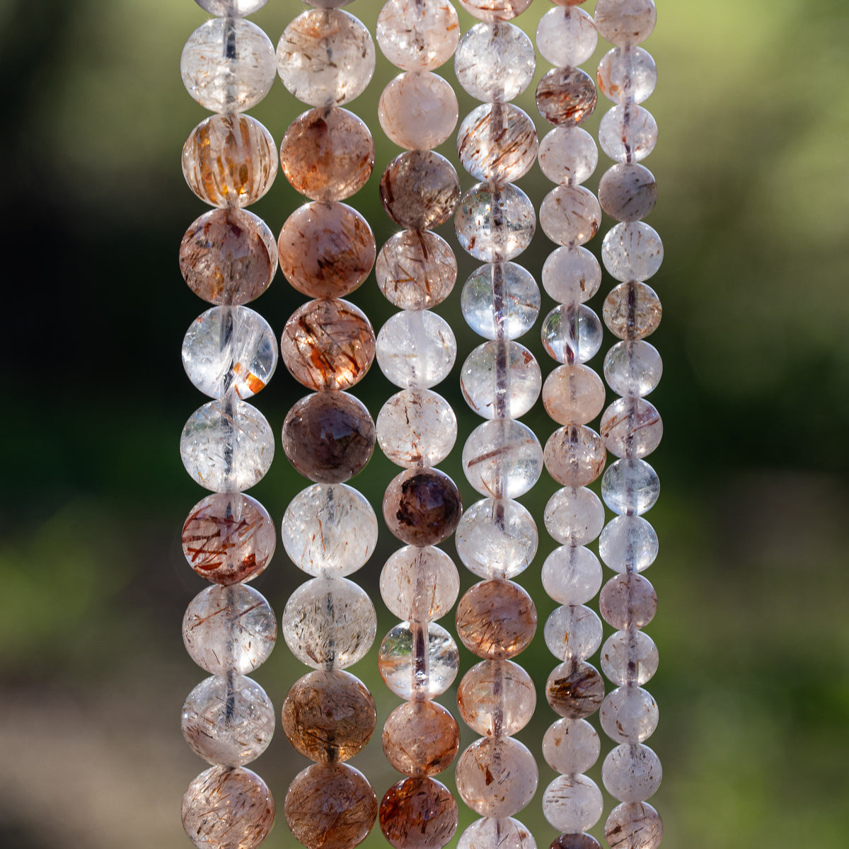 Perles rondes lisses de Quartz à inclusions de Rutile rouge de 10 mm ( 1/2 rang )