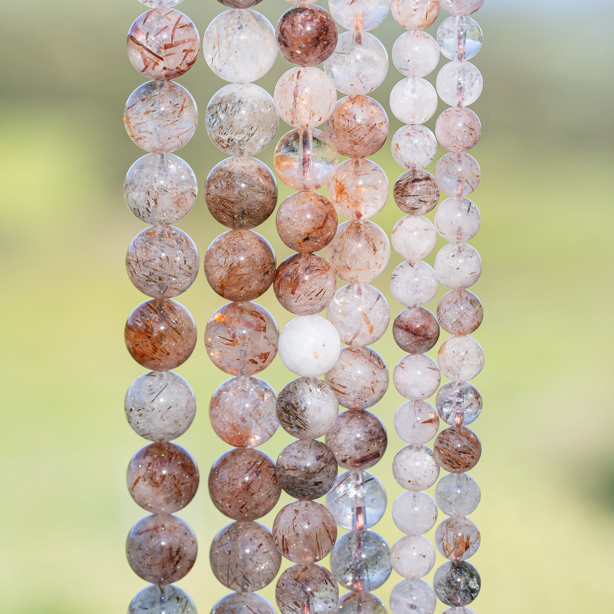 Perles rondes lisses de Quartz à inclusions de Rutile rouge de 6, 8 ou 10 mm ( Rang ou 1/2 rang )