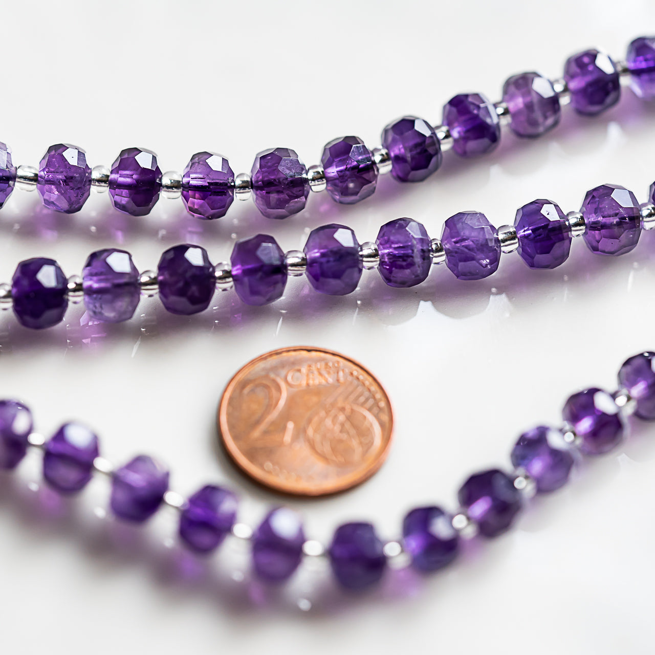 Perles rondelles facettes en Améthyste de 8 x 5,5/6 mm ( 1/2 rang de env 24 perles )