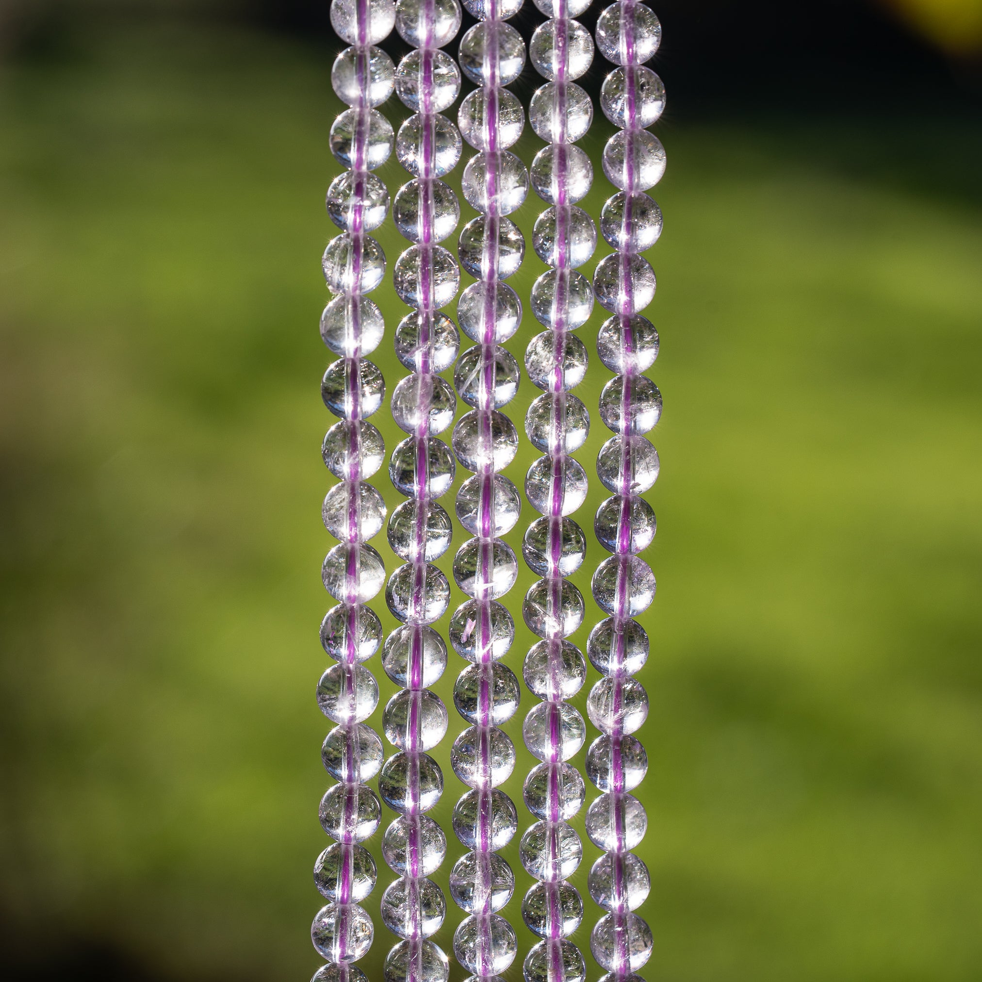 Perles rondes lisses en Améthyste lilas grade A de 6,5 mm ( 1/2 rang de env 30 perles )