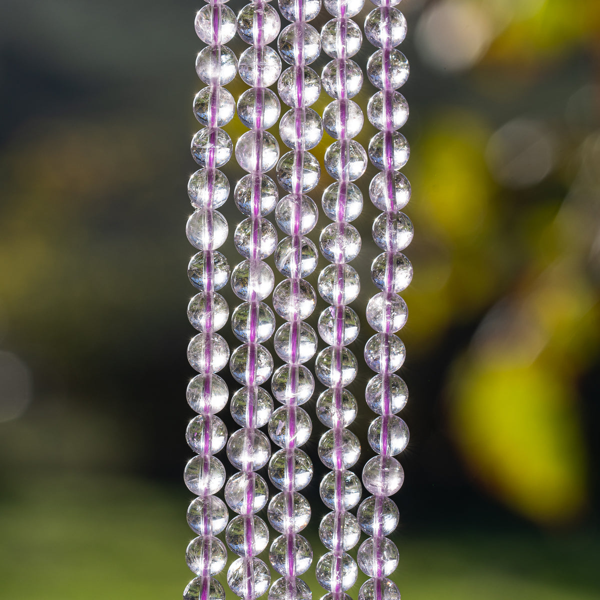Perles rondes lisses en Améthyste lilas grade A de 6,5 mm ( 1/2 rang de env 29/30 perles )
