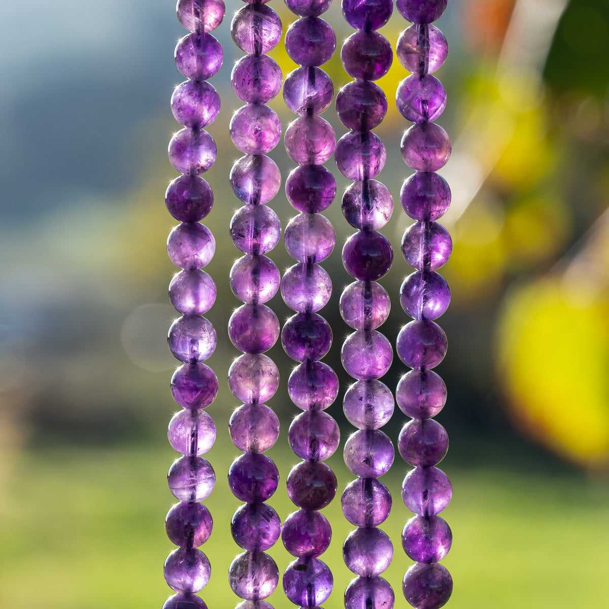 Perles rondes lisses en Améthyste de 8,5 mm ( rang de env 46 perles )