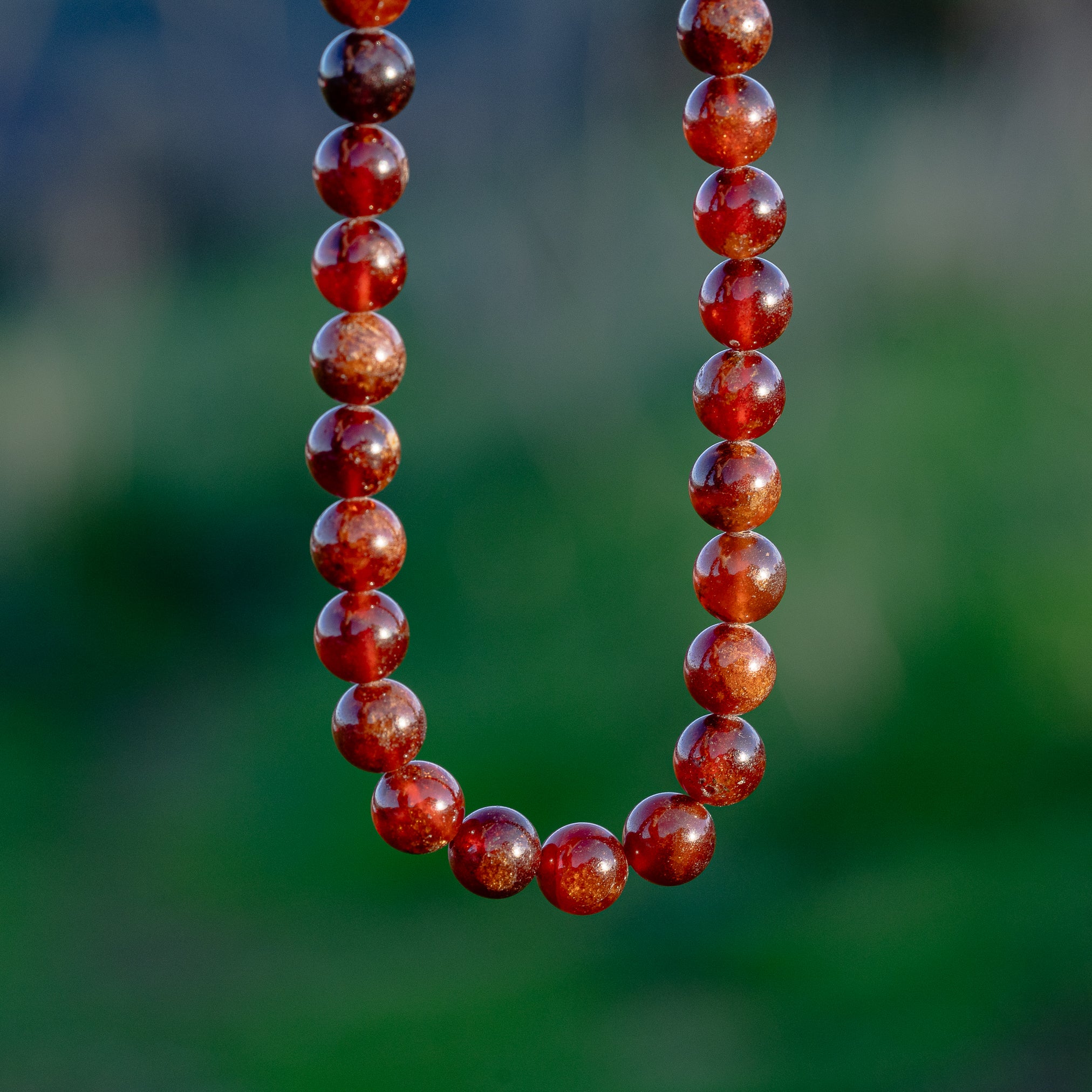 Perles rondes lisses de Grenat orange de 8 mm ( 1/2 rang de env 24 perles )