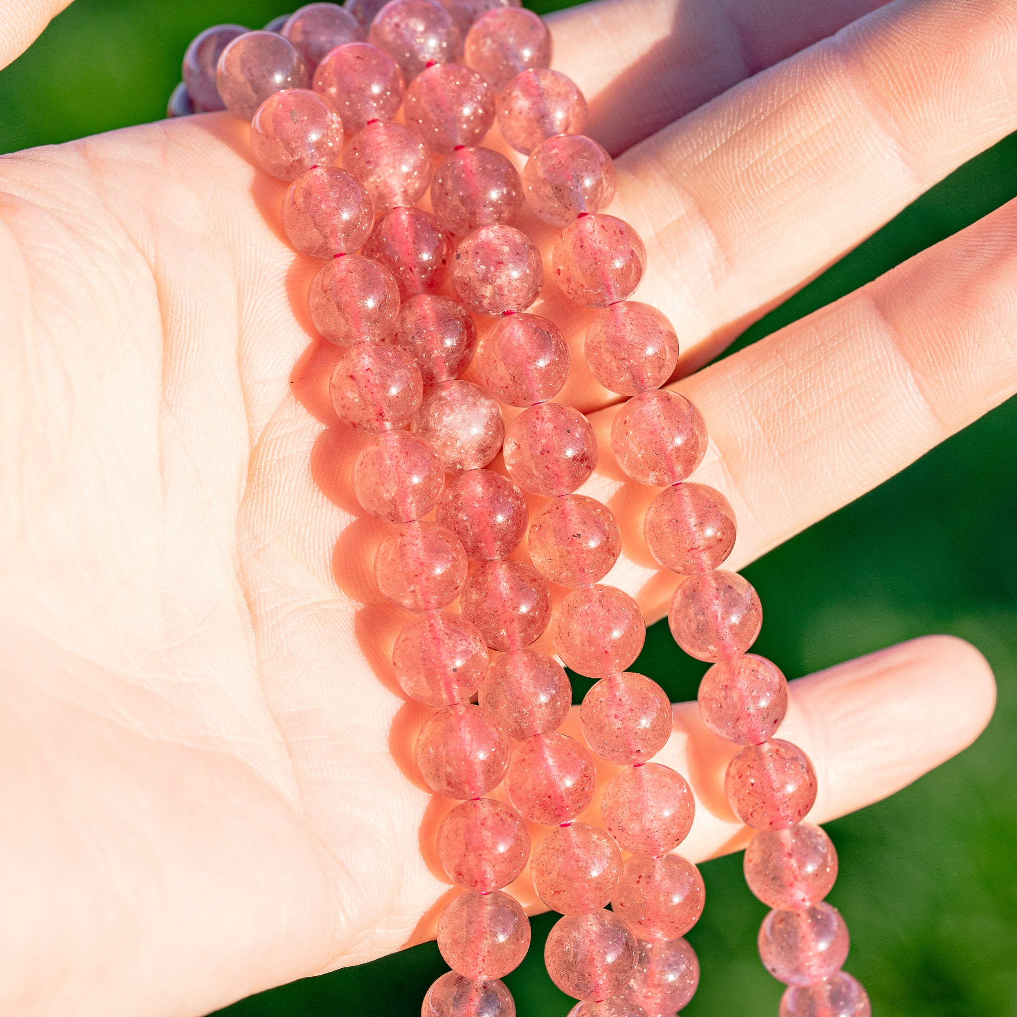 Perles rondes lisses de Quartz fraise de 8,5 mm ( 1/2 rang de env 23 perles )
