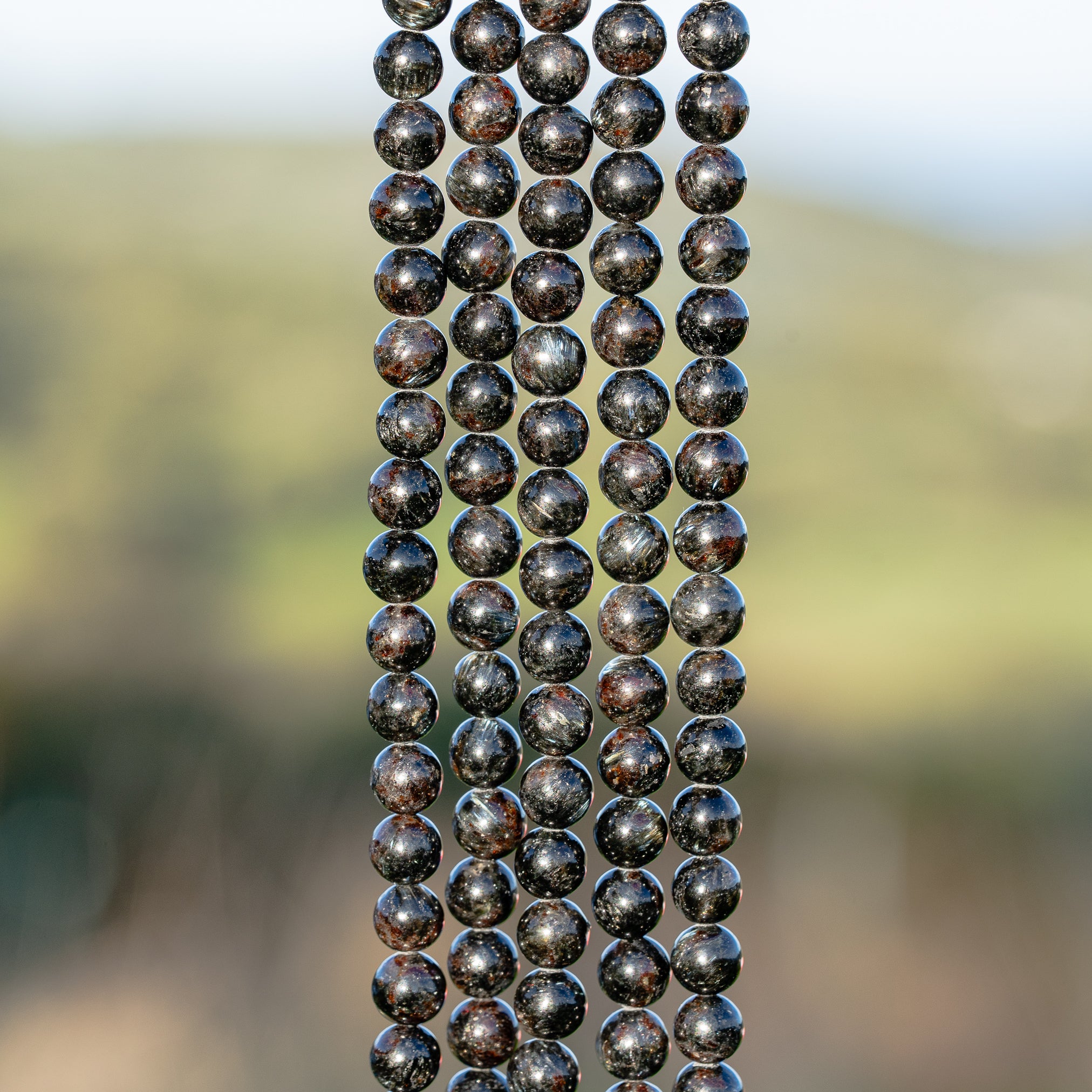 Perles rondes lisse en Arfvedsonite de 6 mm ( 1/2 rang ou rang )
