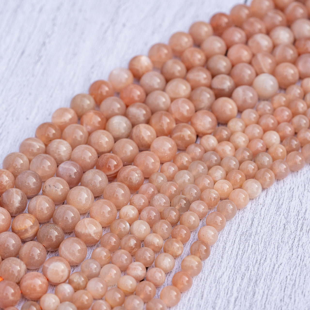 Perles rondes lisses de Pierre de soleil de 6/8 mm ( par 1/2 rangs )
