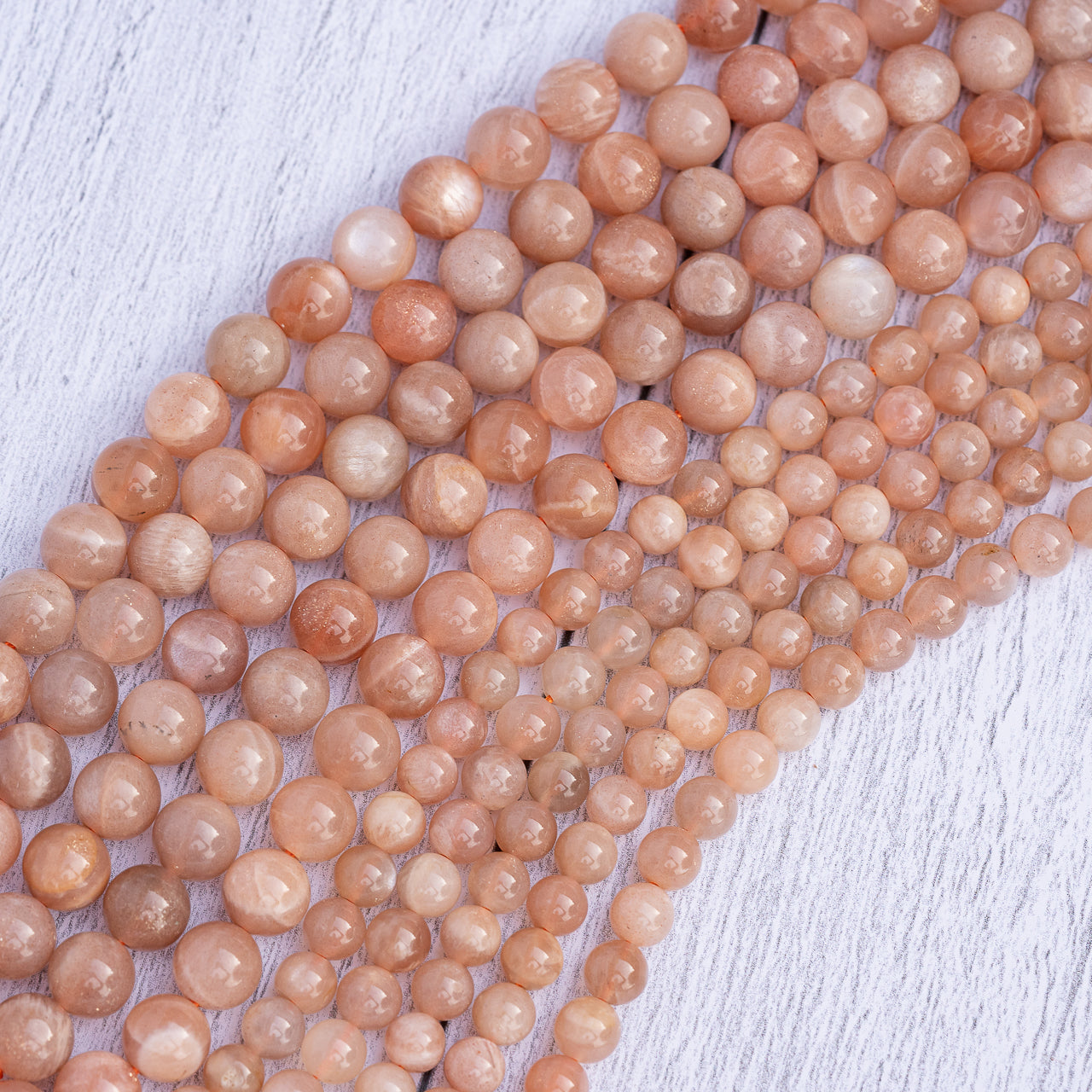 Perles rondes lisses de Pierre de soleil de 6/8 mm ( par 1/2 rangs )