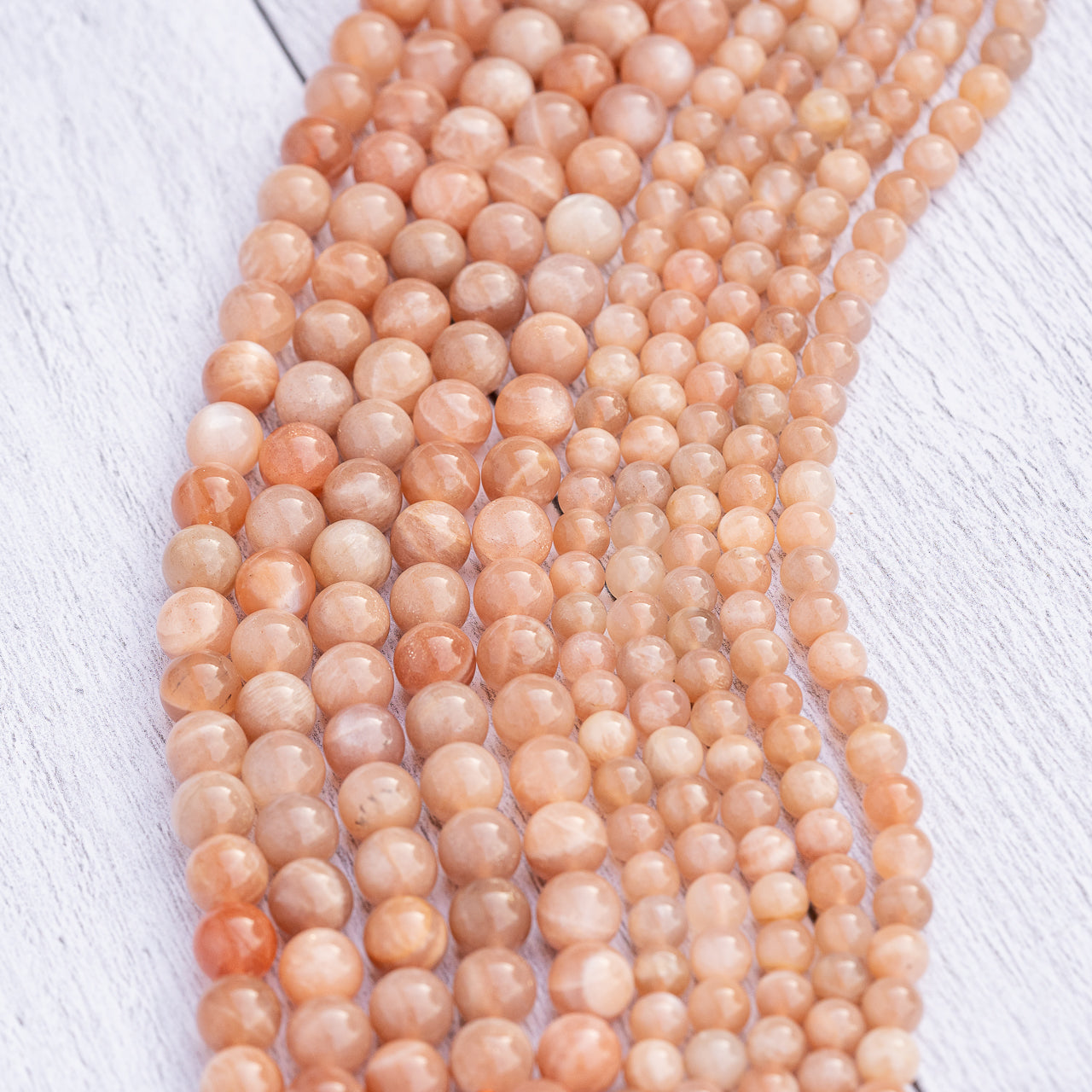 Perles rondes lisses de Pierre de soleil de 6/8 mm ( par 1/2 rangs )