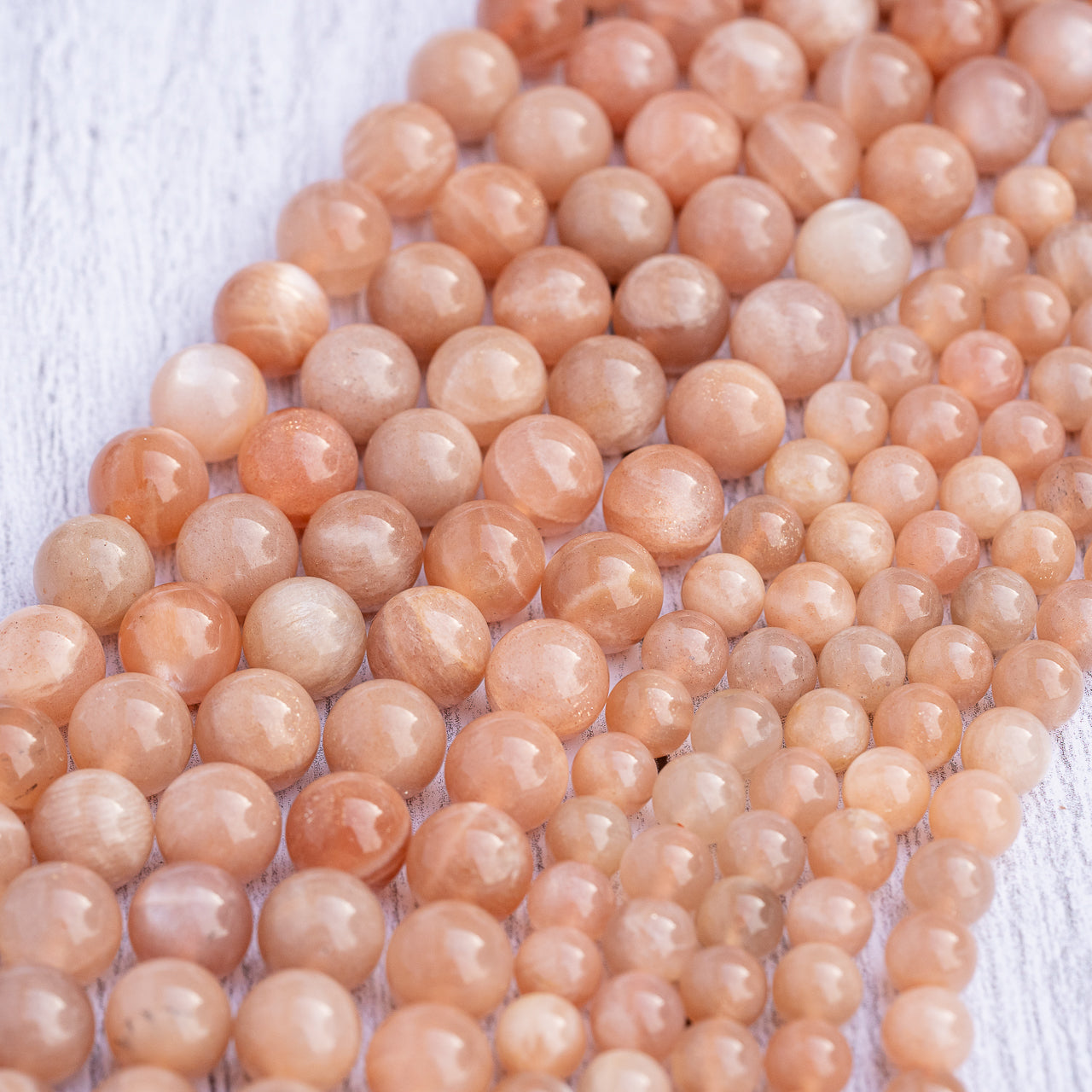 Perles rondes lisses de Pierre de soleil de 6/8 mm ( par 1/2 rangs )