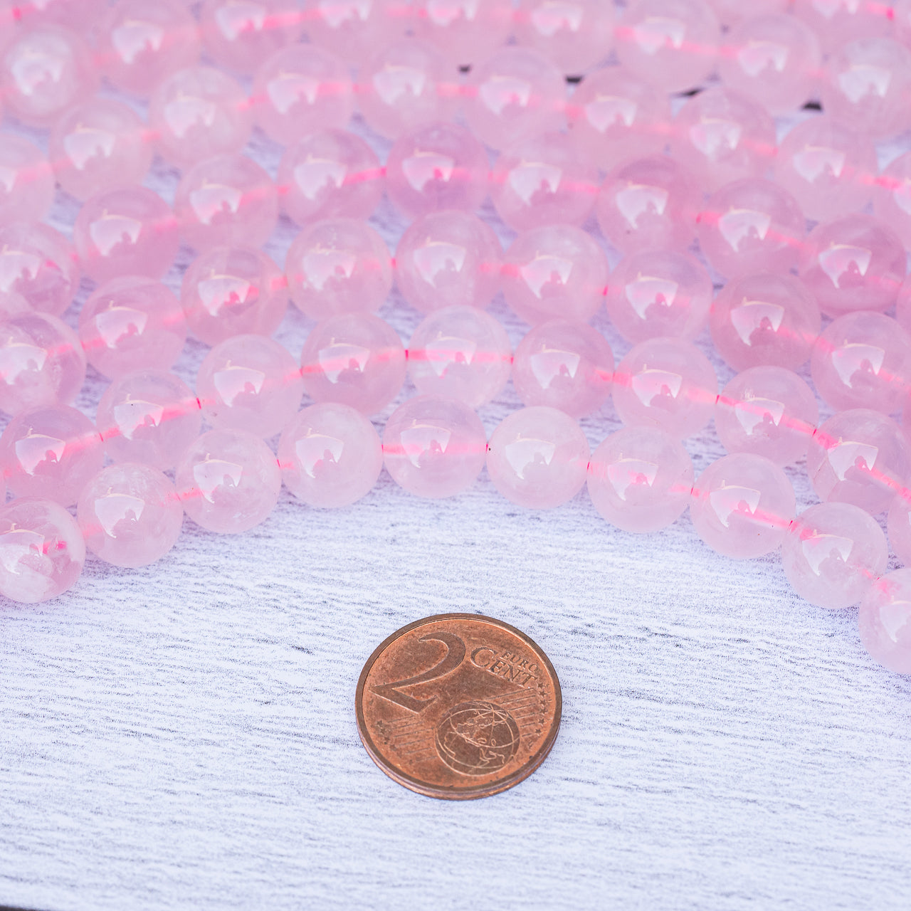 Perles rondes lisses de Quartz rose Madagascar de 10 mm ( 1/2 rang de env 20 perles )