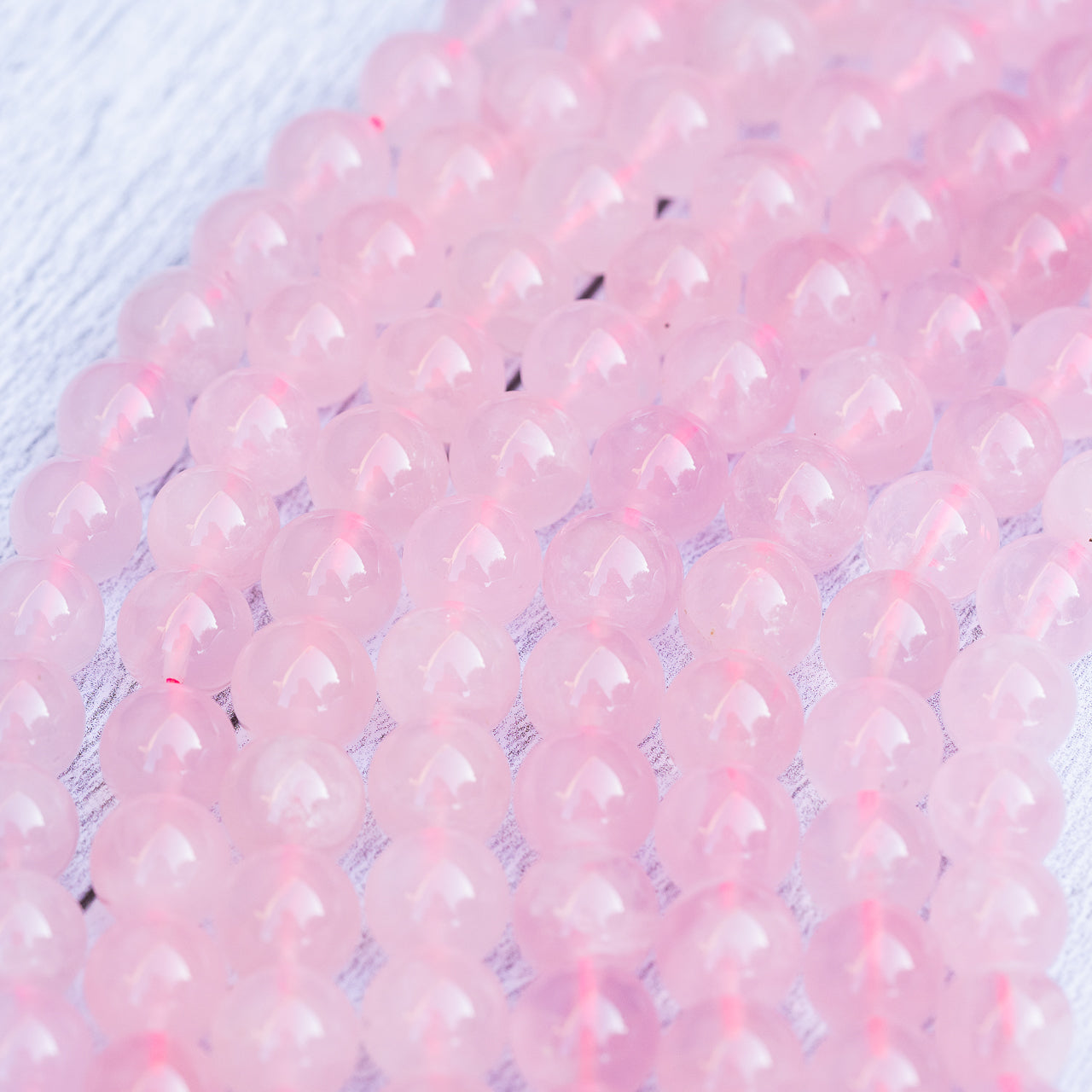 Perles rondes lisses de Quartz rose Madagascar de 10 mm ( 1/2 rang de env 20 perles )