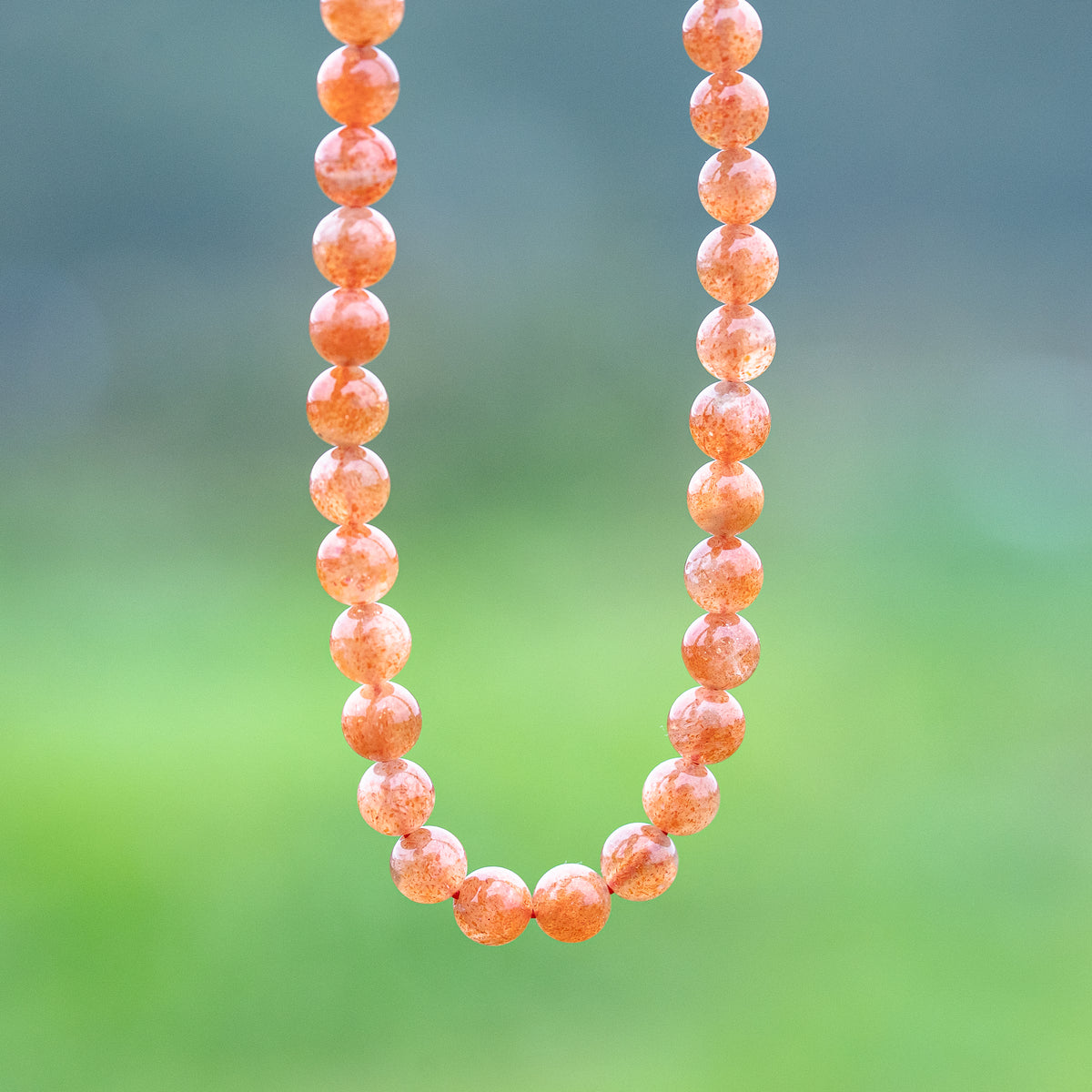 Perles rondes lisses de Pierre de soleil extra de 7 mm ( lot de 6 perles ou 1/2 rang )