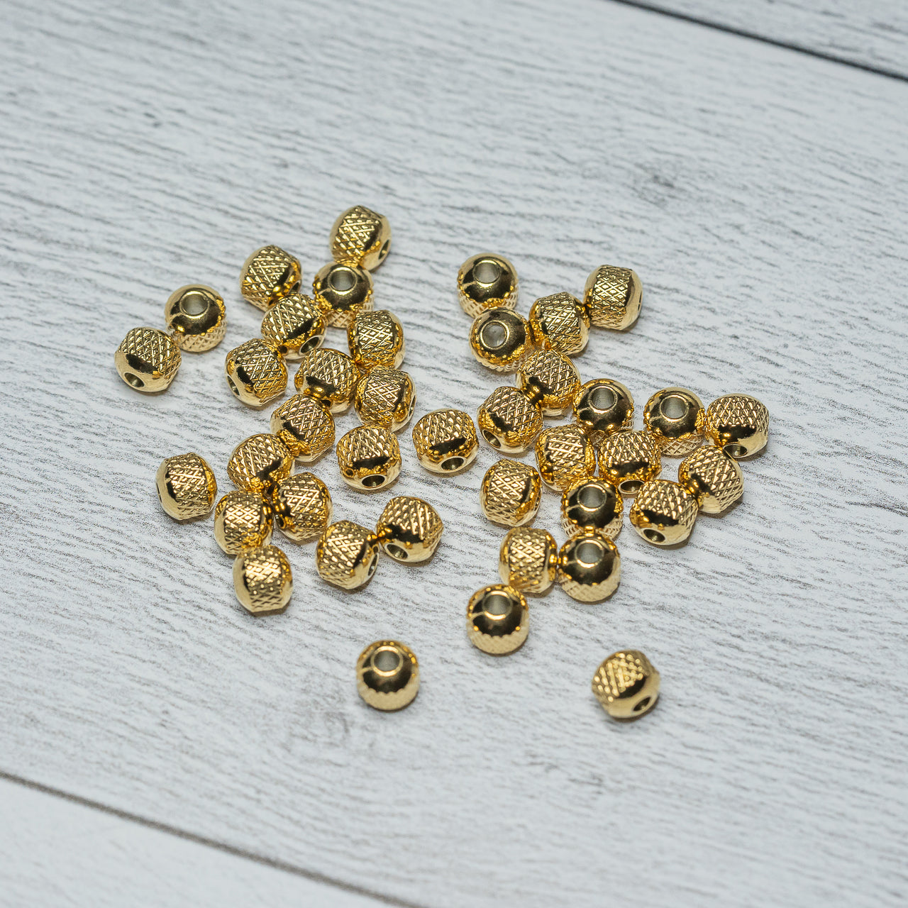 Perles rondelles striées en acier inoxydable plaqué or 18k de 6 x 5 mm ( lot de 4 )