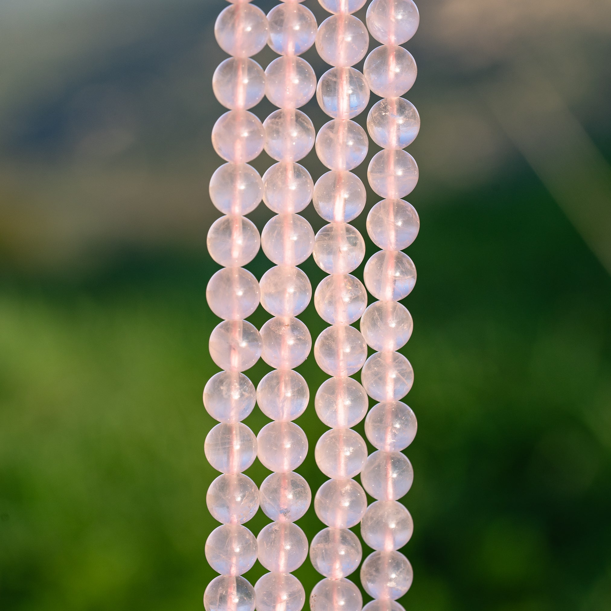 Perles rondes lisses de Quartz rose clair de 8 mm ( rang de env 48 perles )