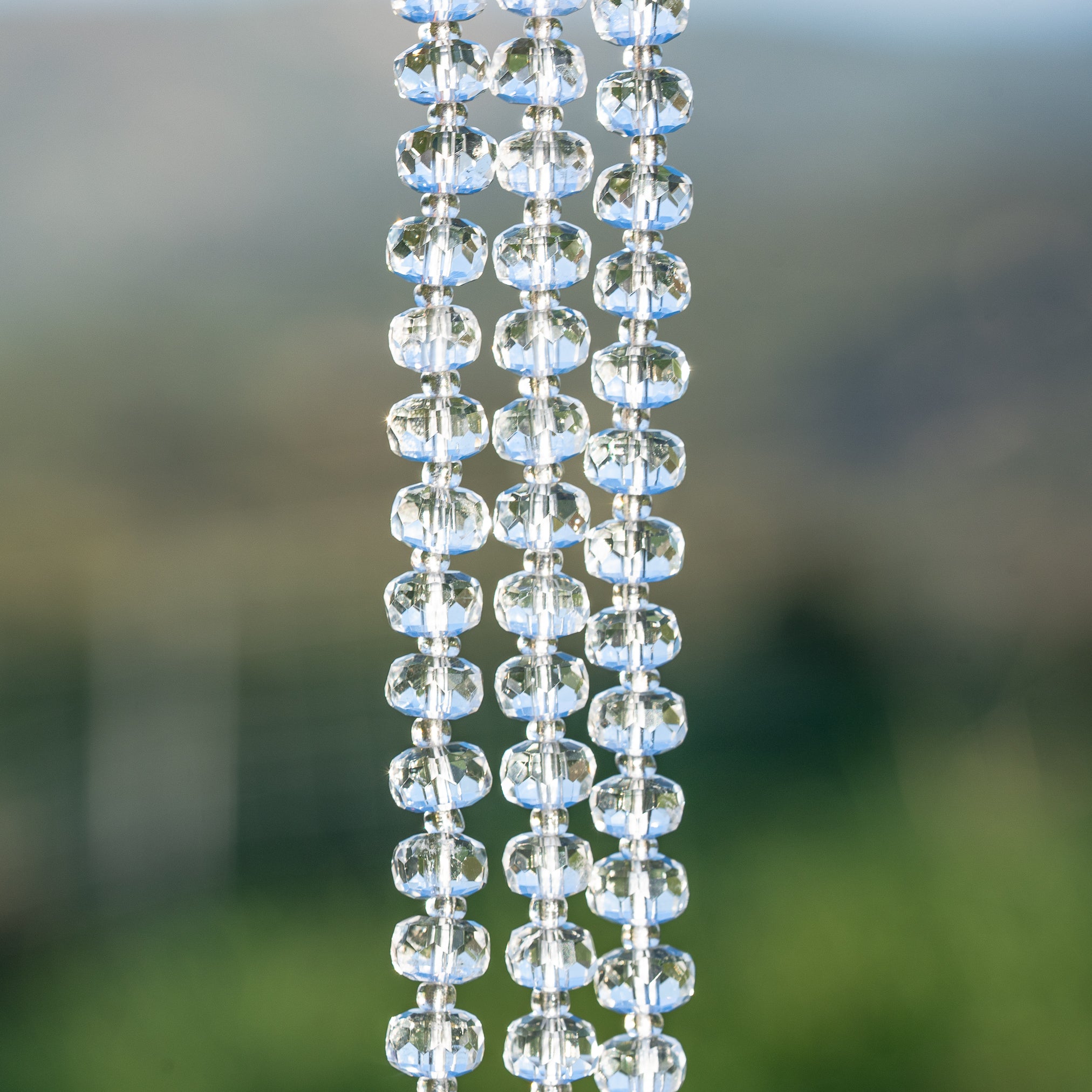 Perles rondelles facettes de Cristal de roche clair de env 7,5 x 5 mm ( 1/2 rang de env 28 perles )