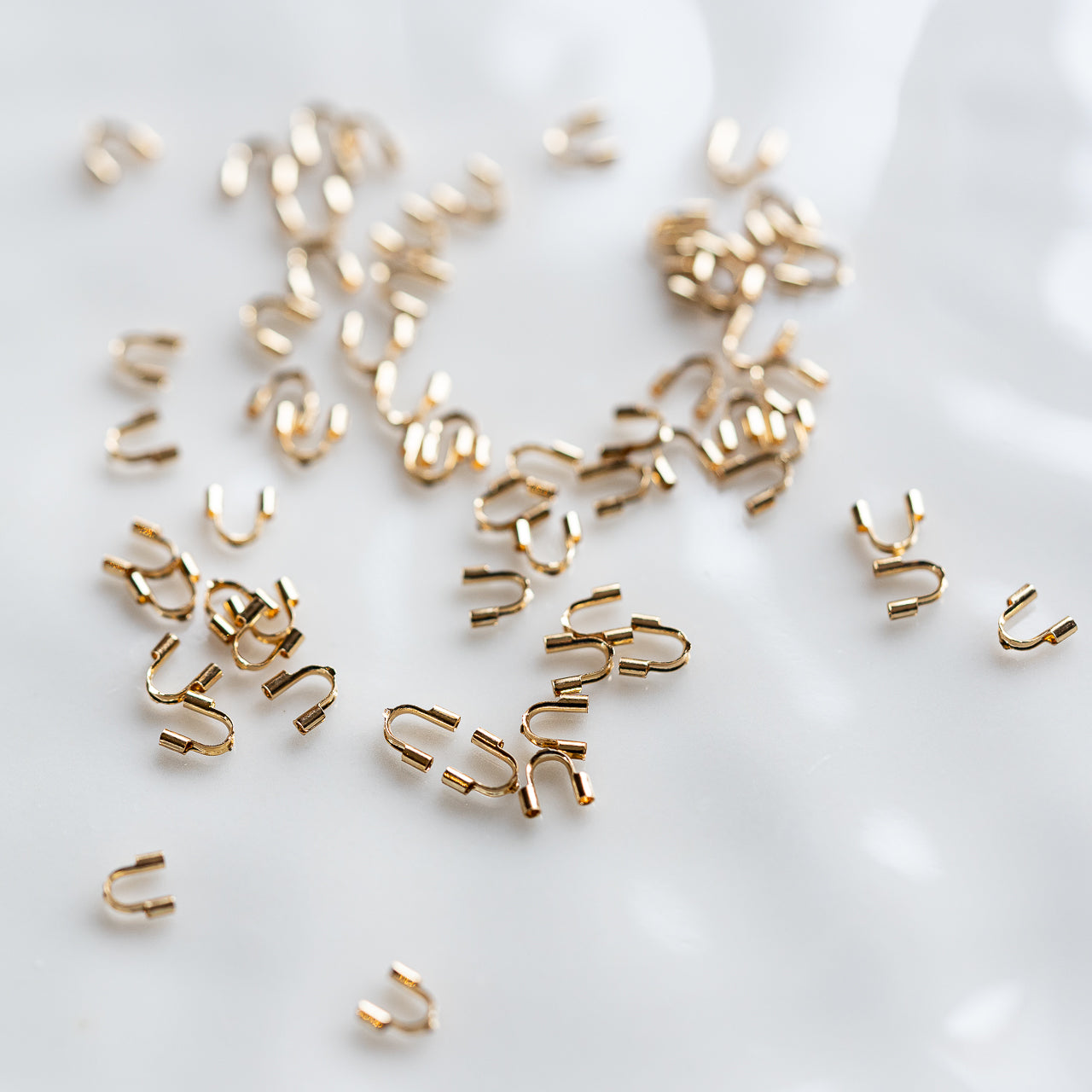 Protèges câble en acier inoxydable plaqué or 18k de 5 mm ( vendus par 4 )