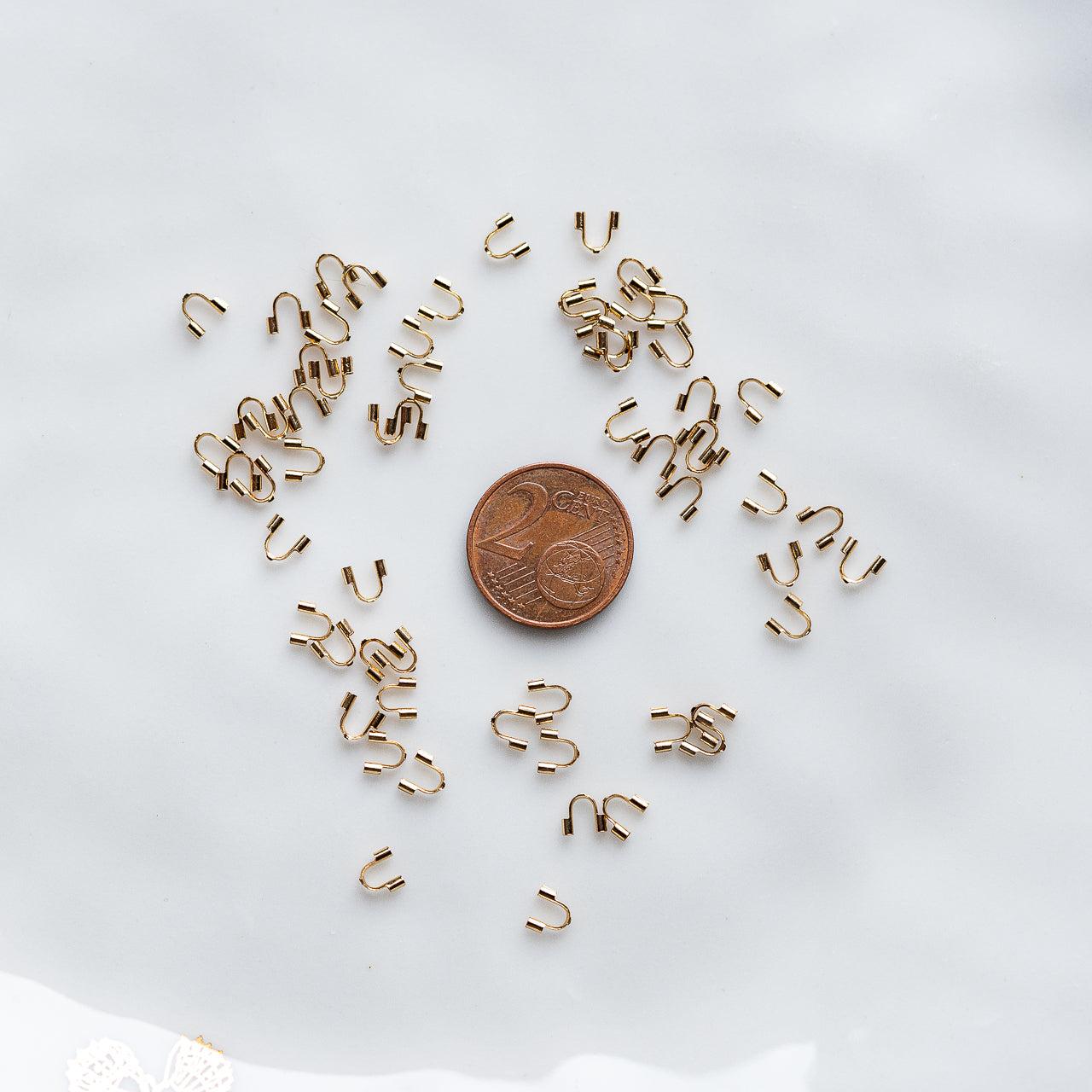 Protèges câble en acier inoxydable plaqué or 18k de 5 mm ( vendus par 4 )
