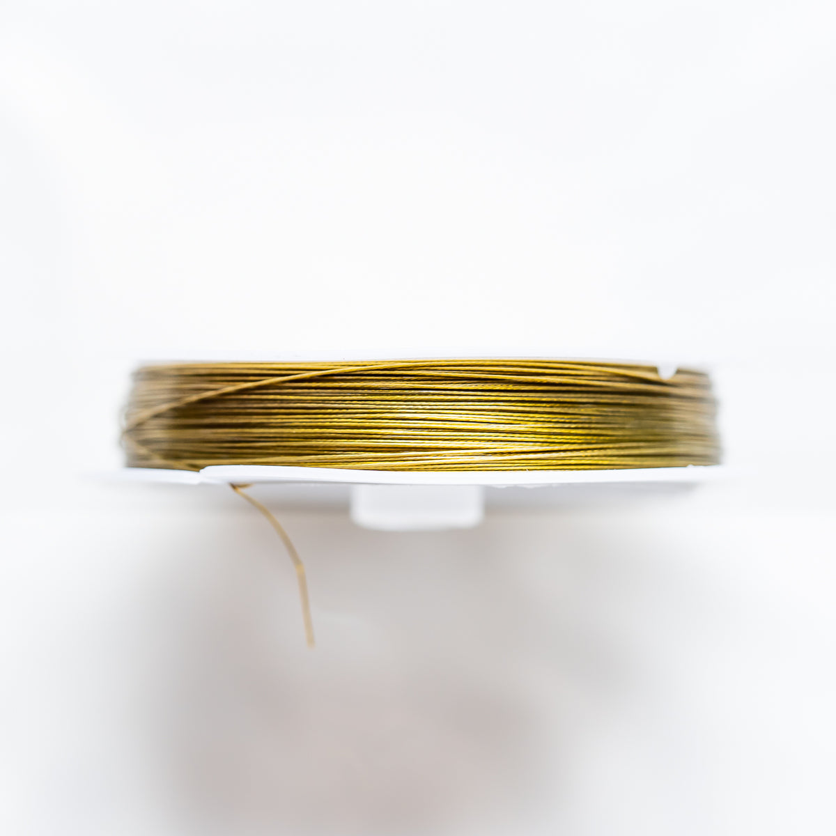 Fil câblé en acier inoxydable doré de 0,45 mm ( bobine de 50 mètres )