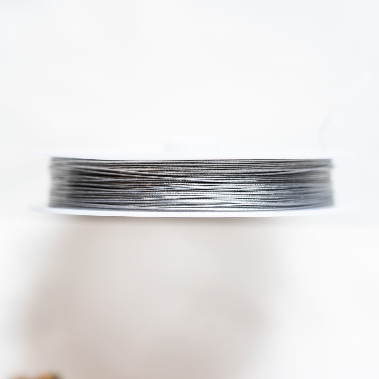 Fil câblé en acier inoxydable argenté de 0,38 mm ( bobine de 60 mètres )