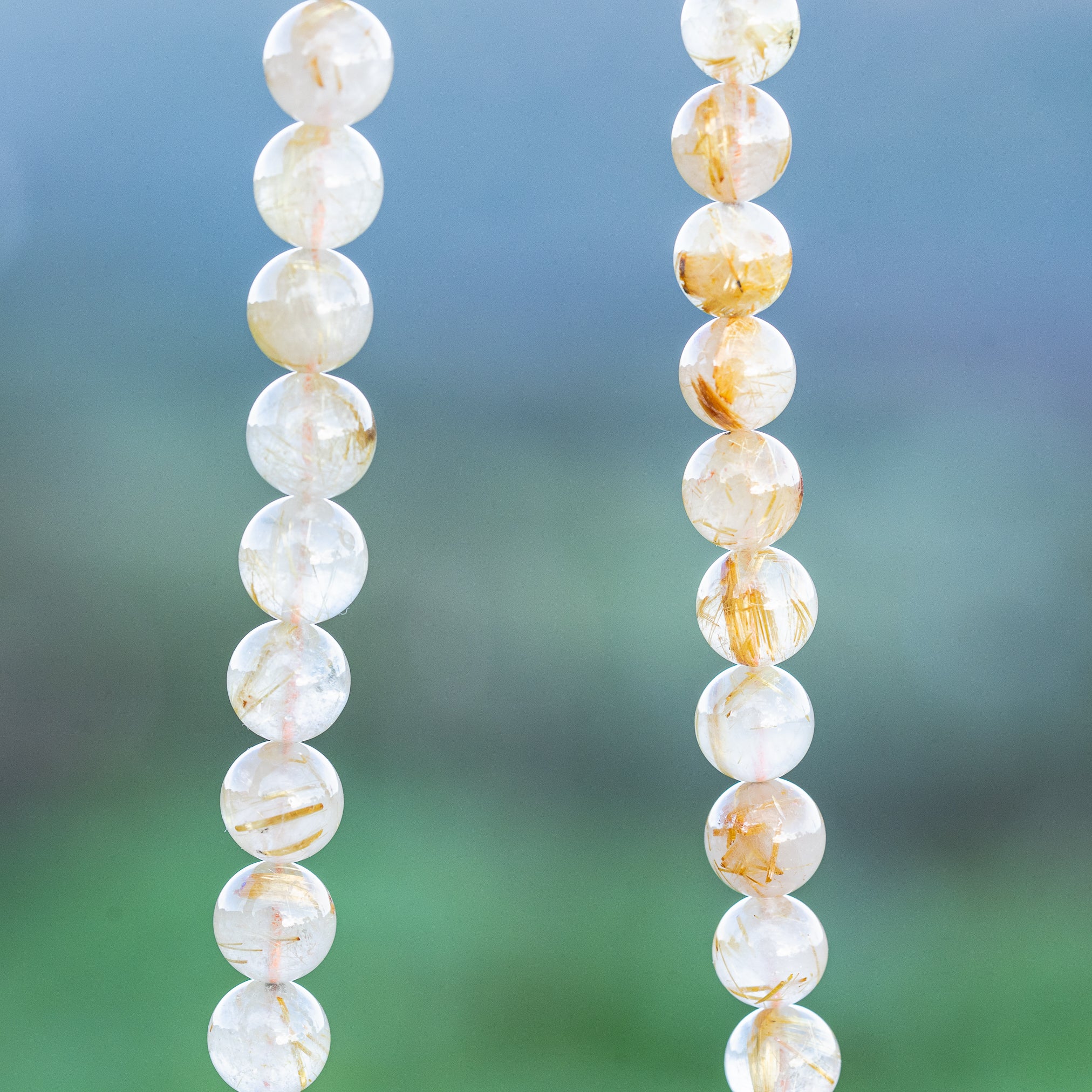 Perles rondes lisses de Quartz Rutile doré de 8,7 mm ( 1/4 de rang de env 11 perles )