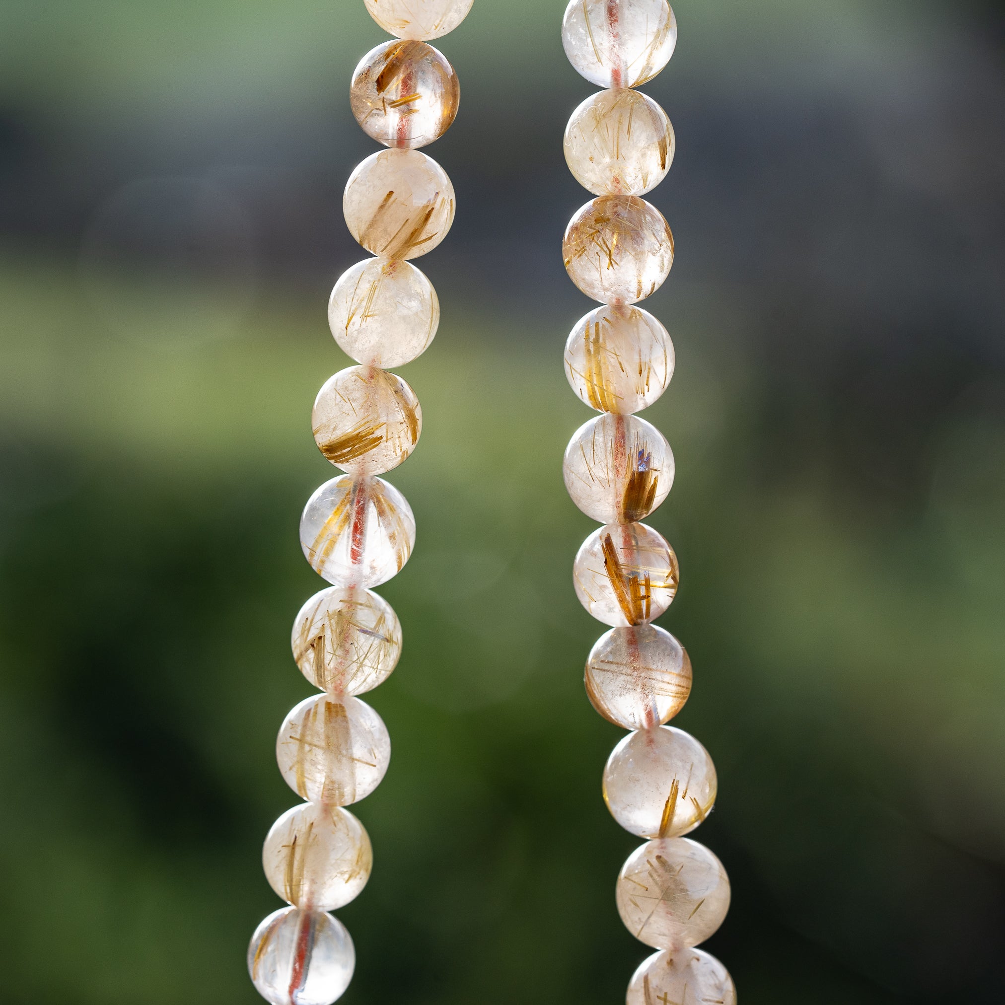 Perles rondes lisses de Quartz Rutile doré de 8,7 mm ( 1/4 de rang de env 11 perles )