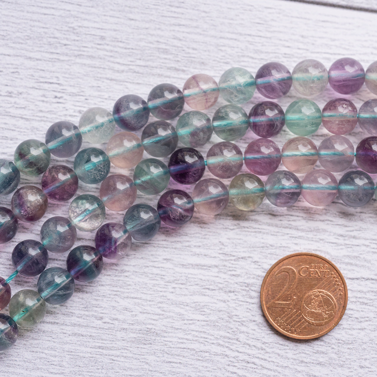 Perles rondes lisses de Fluorite multicolore de 7/8 mm ( rang de env 50/52 perles )