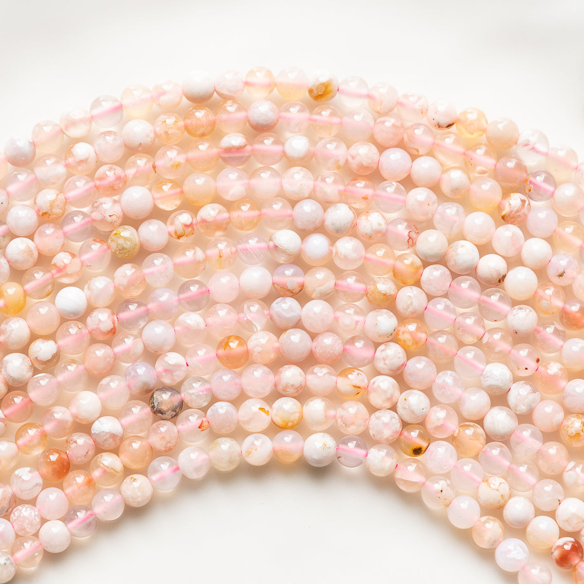 Perles rondes en lisses en Agate fleur de cerisier de 6,5 mm ( rang de env 59 perles )