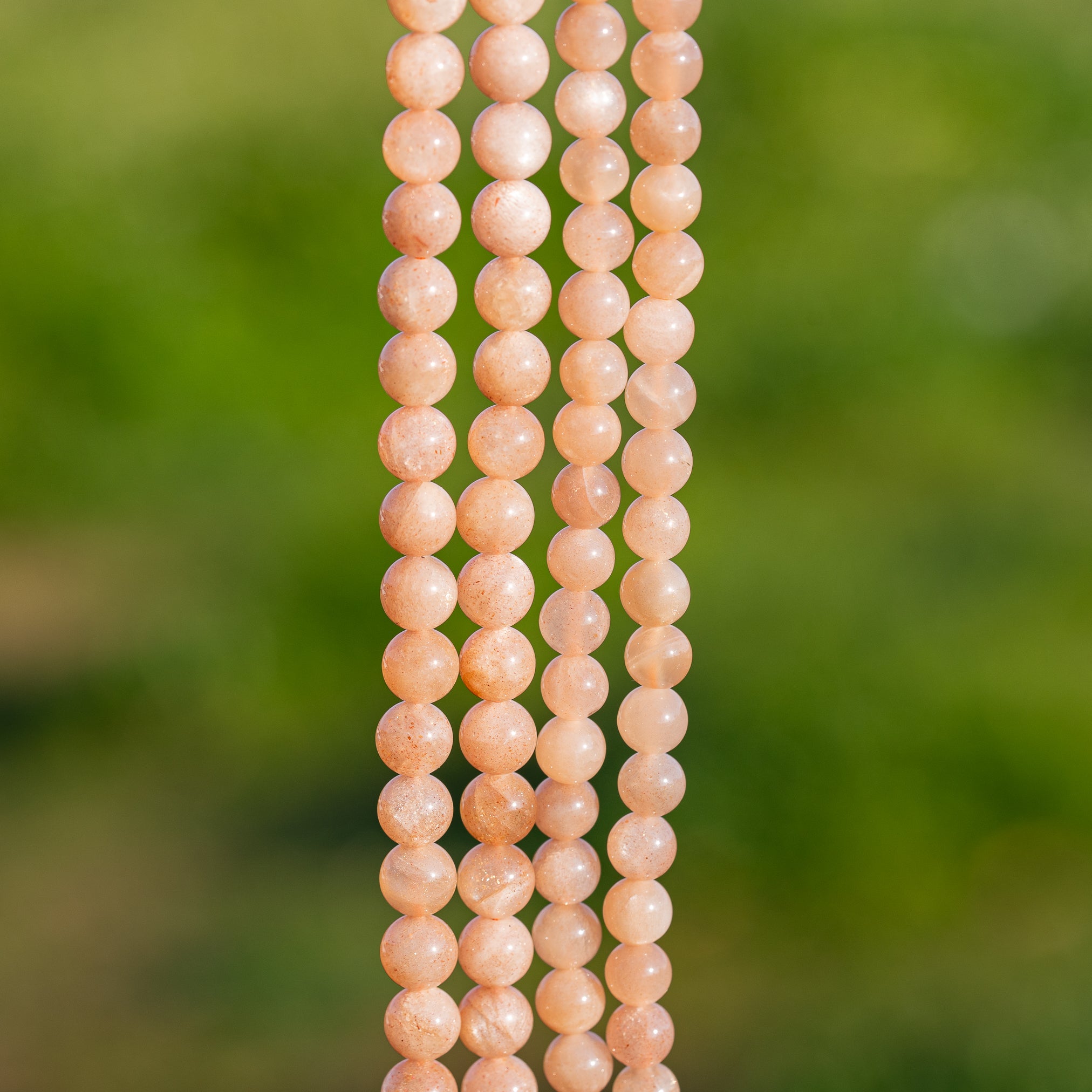 Perles rondes lisses de Pierre de soleil de 6 mm ( par 1/2 rang )