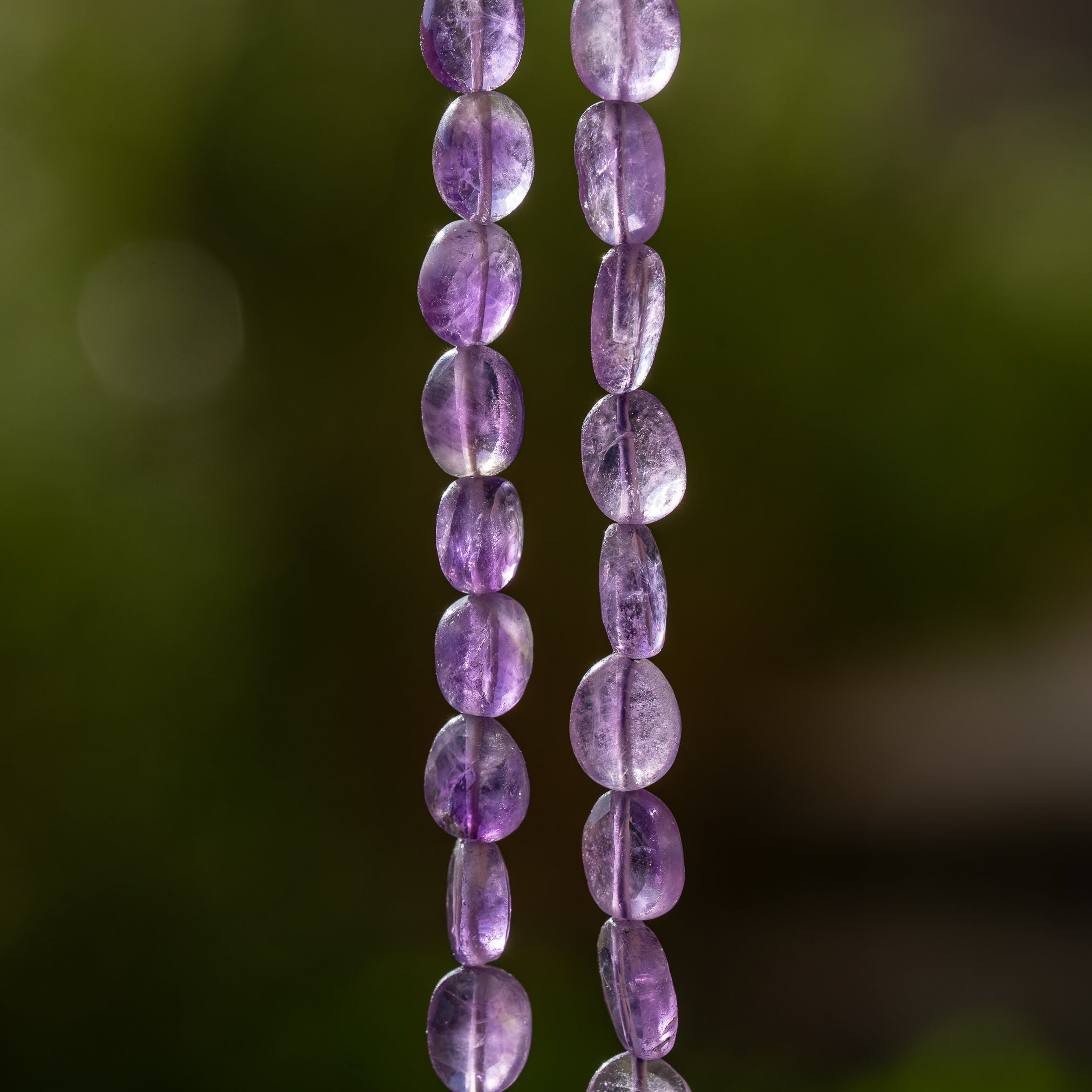 Fils de 31/32 cm de perles ovales facettes en Améthyste de env 7/11 mm
