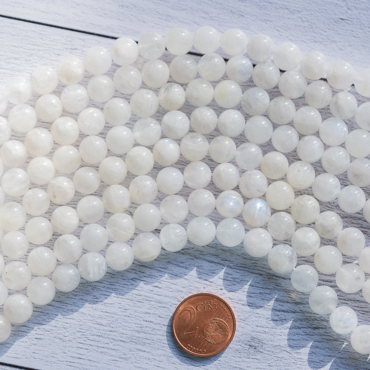 Perles rondes lisses de Labradorite blanche de 8/8,5 mm ( 1/2 rang de env 23/25 perles )