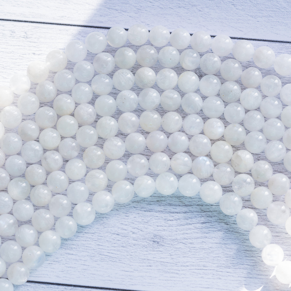 Perles rondes lisses de Labradorite blanche de 8/8,5 mm ( 1/2 rang de env 23/25 perles )