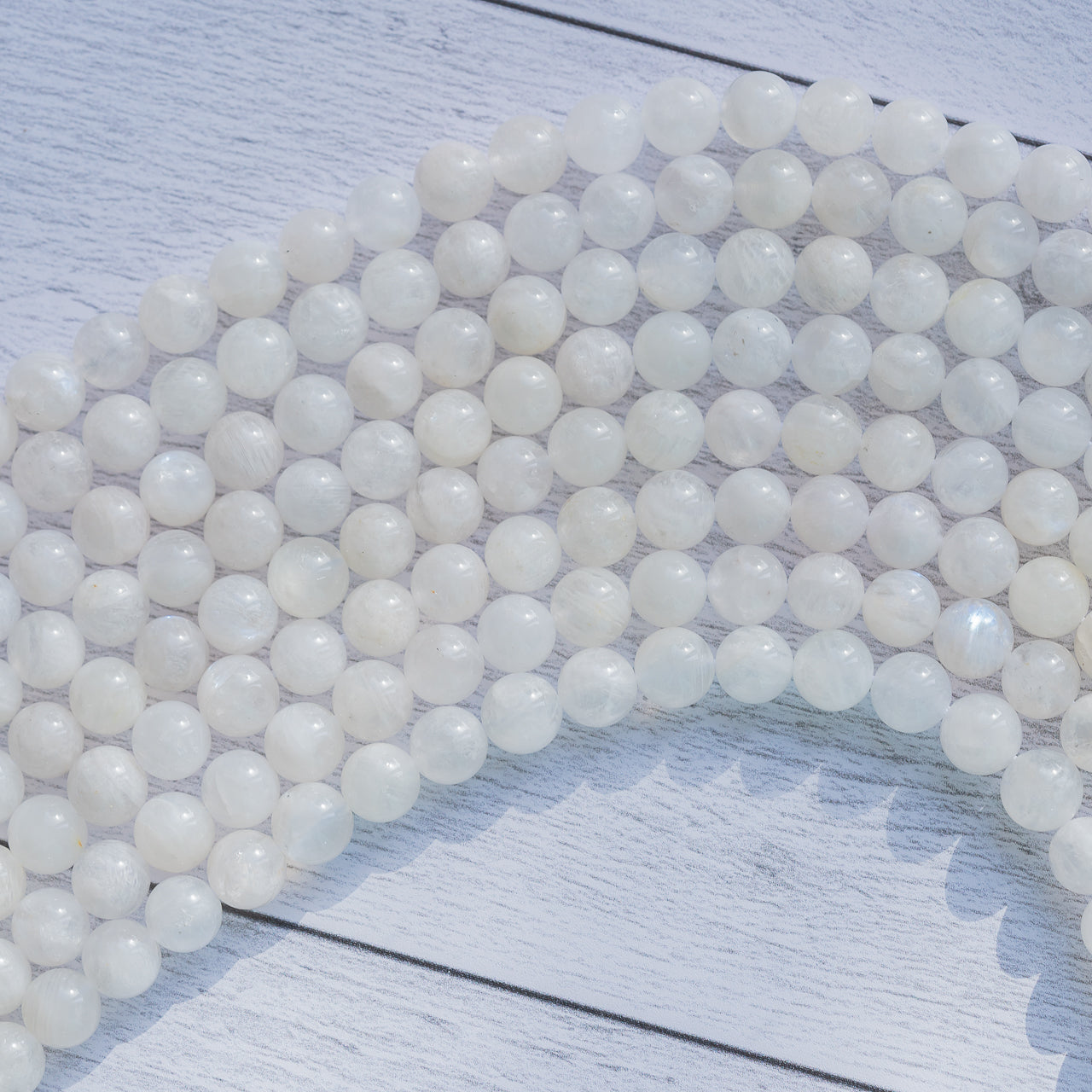 Perles rondes lisses de Labradorite blanche de 8/8,5 mm ( 1/2 rang de env 23/25 perles )