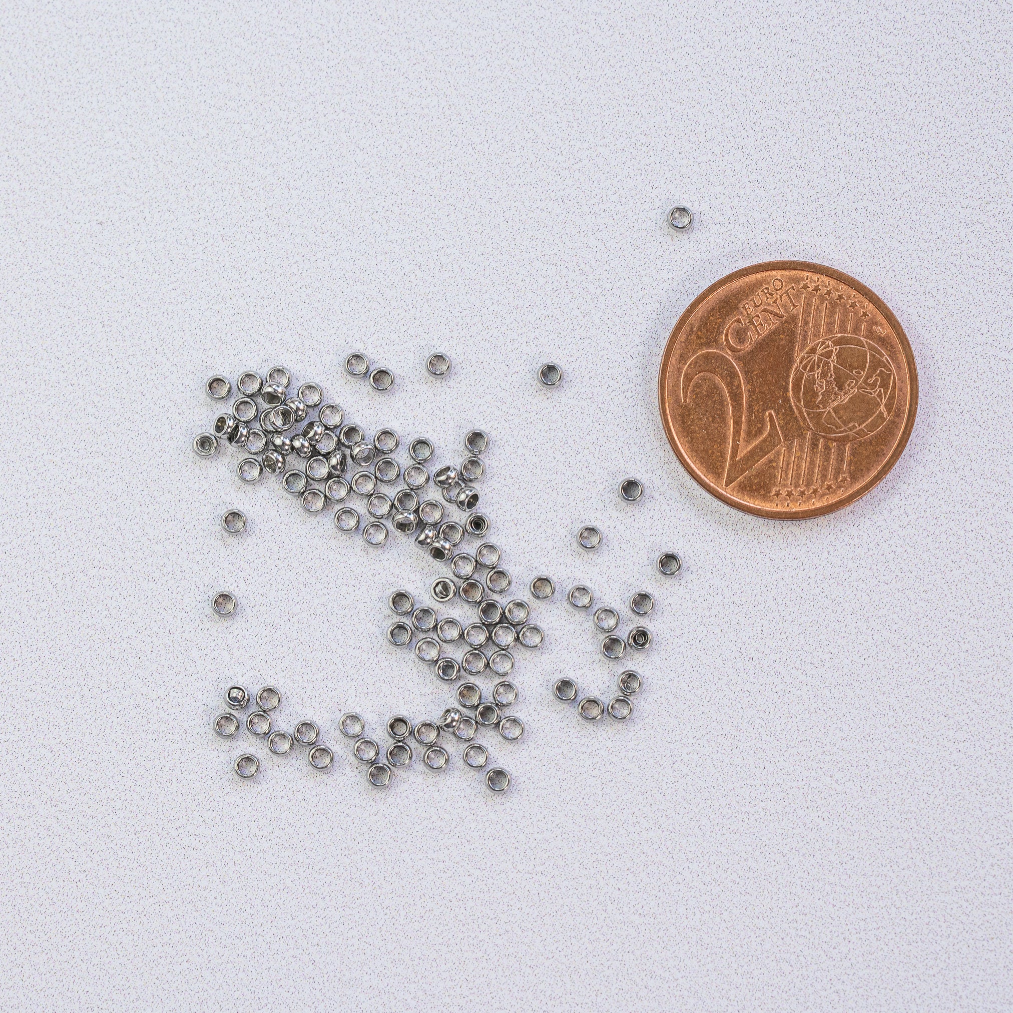 Perles à écraser/sertir en acier inoxydable chirurgical de 1,9 x 0,9 mm ( lot de 10 )