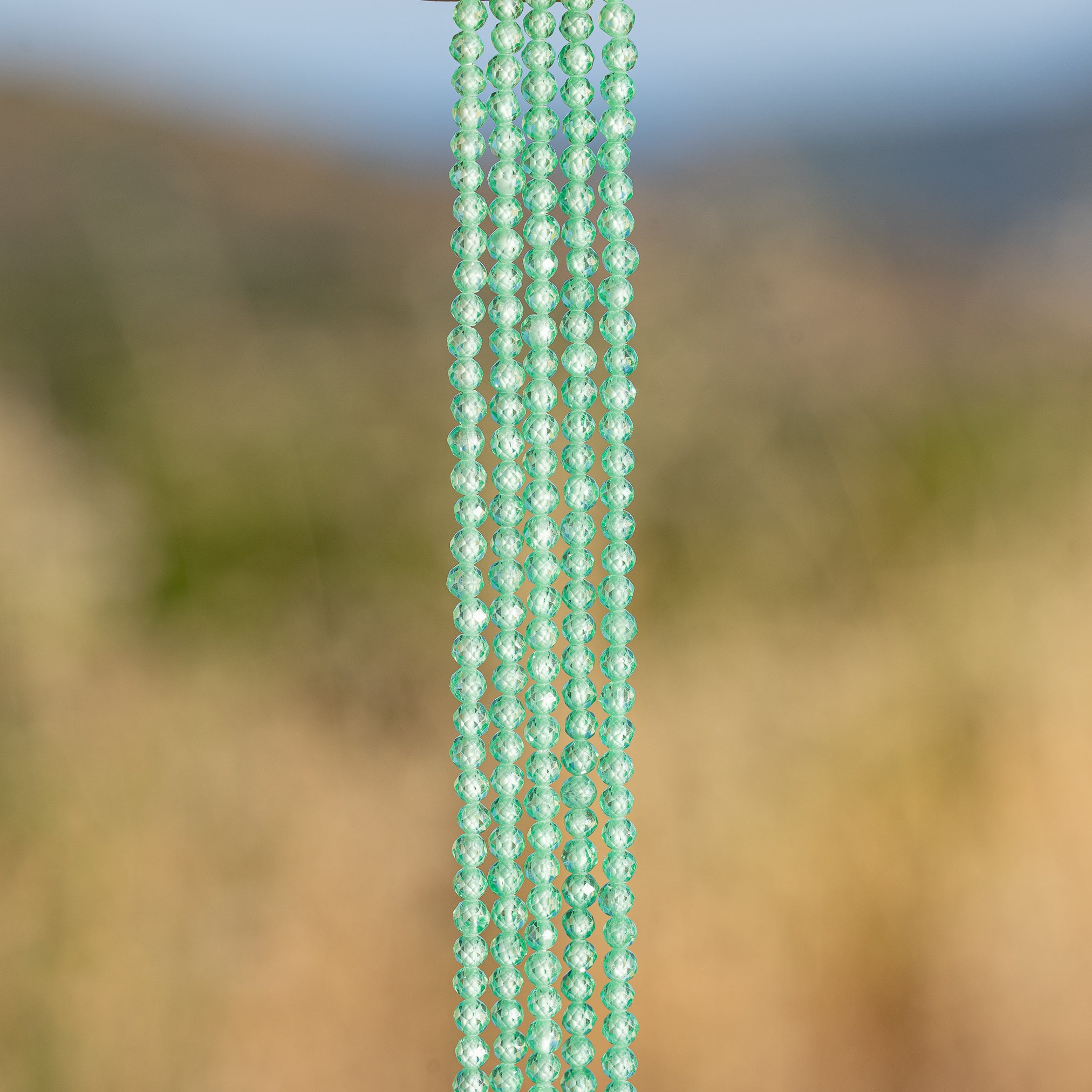 Perles rondes facettes de zirconium vert d&