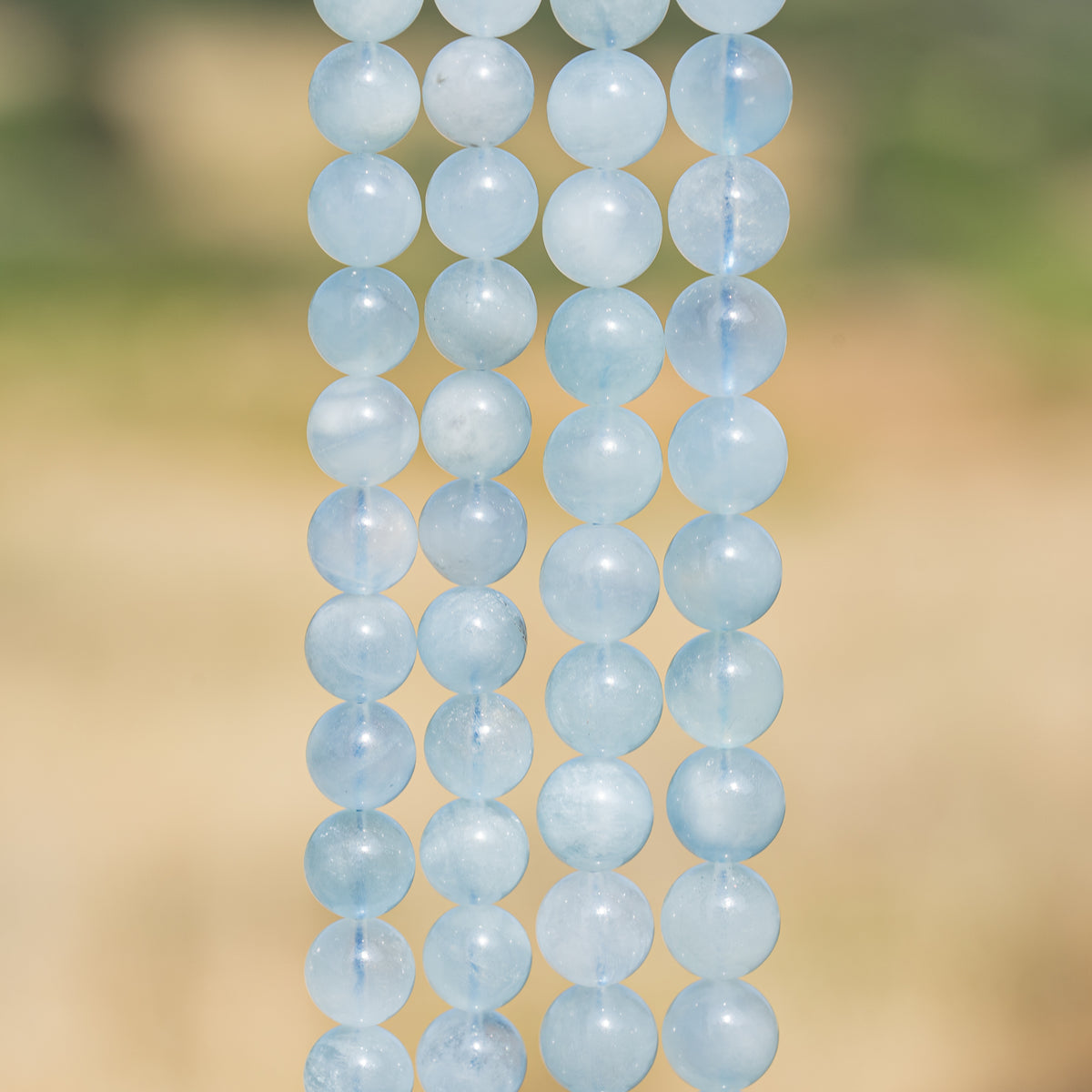 Perles rondes lisses en Aigue-marine de 9,5/10,5 mm ( lot de 10 perles )