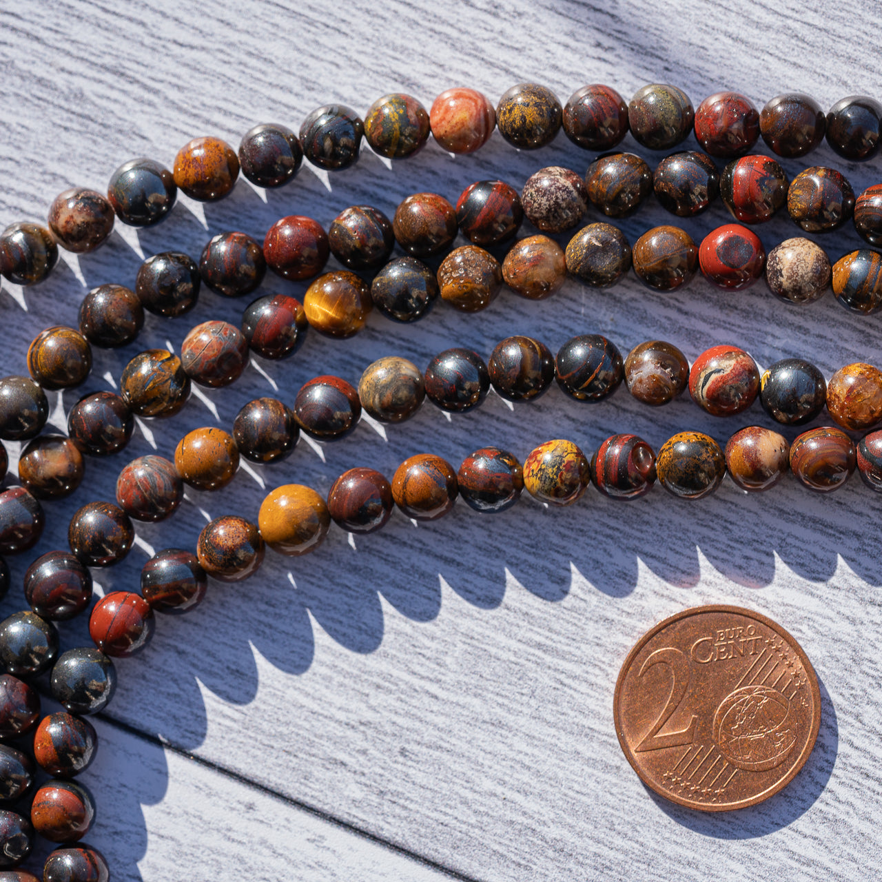 Perles rondes lisses en Oeil de fer de 6 mm ( rang de env 65 perles )