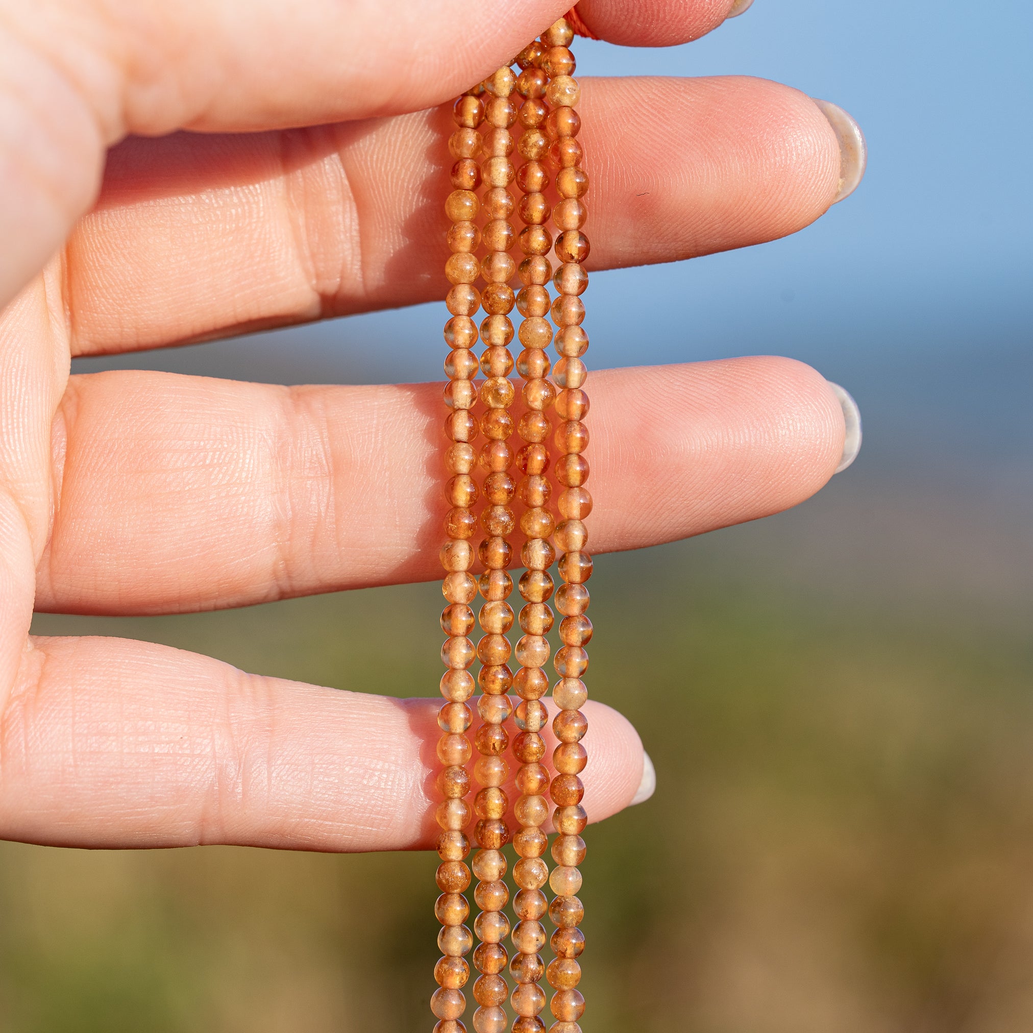 Perles rondes lisses de Grenat orange de 3 mm ( rang de env 144 perles )