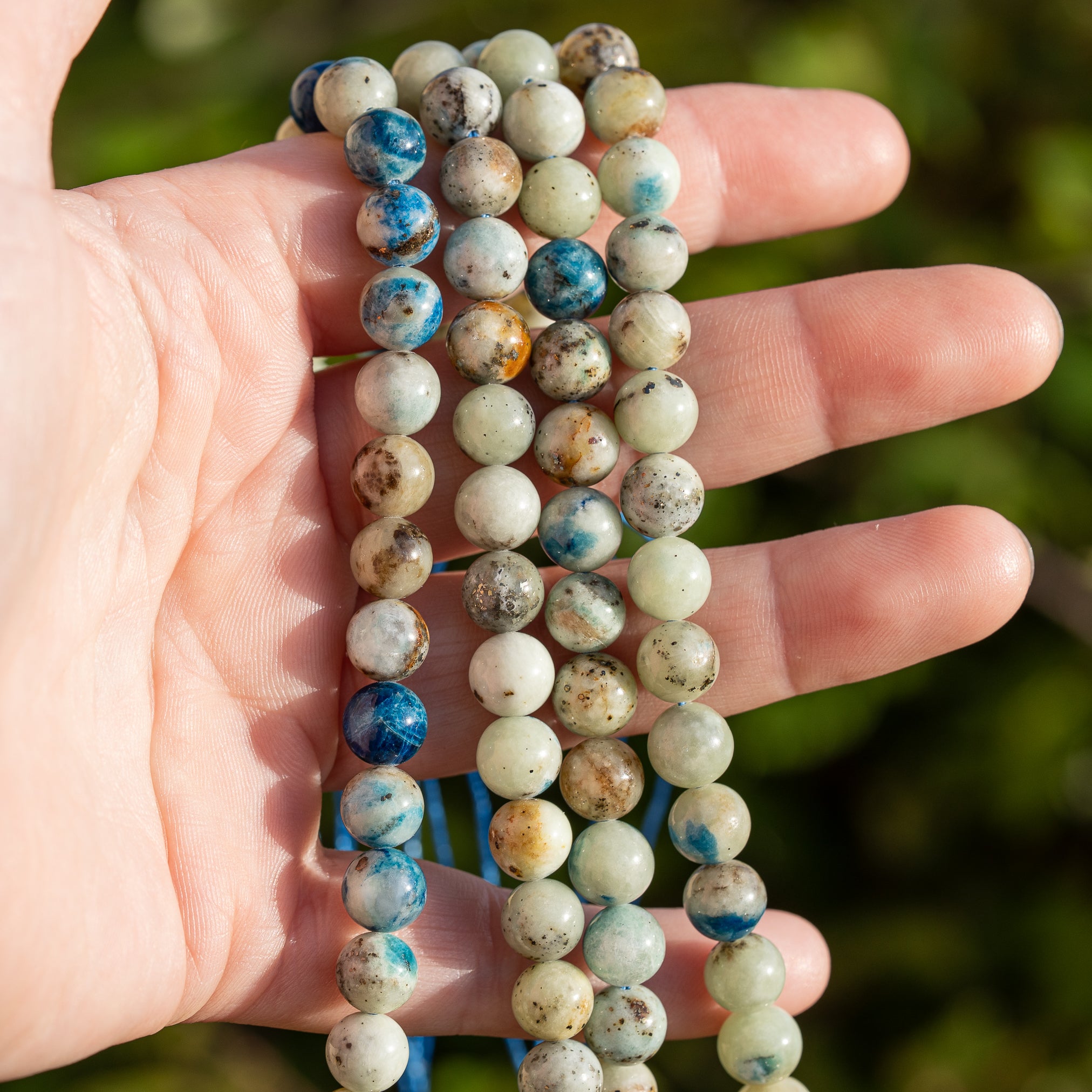 Perles rondes lisses de Calcite à inclusions d&