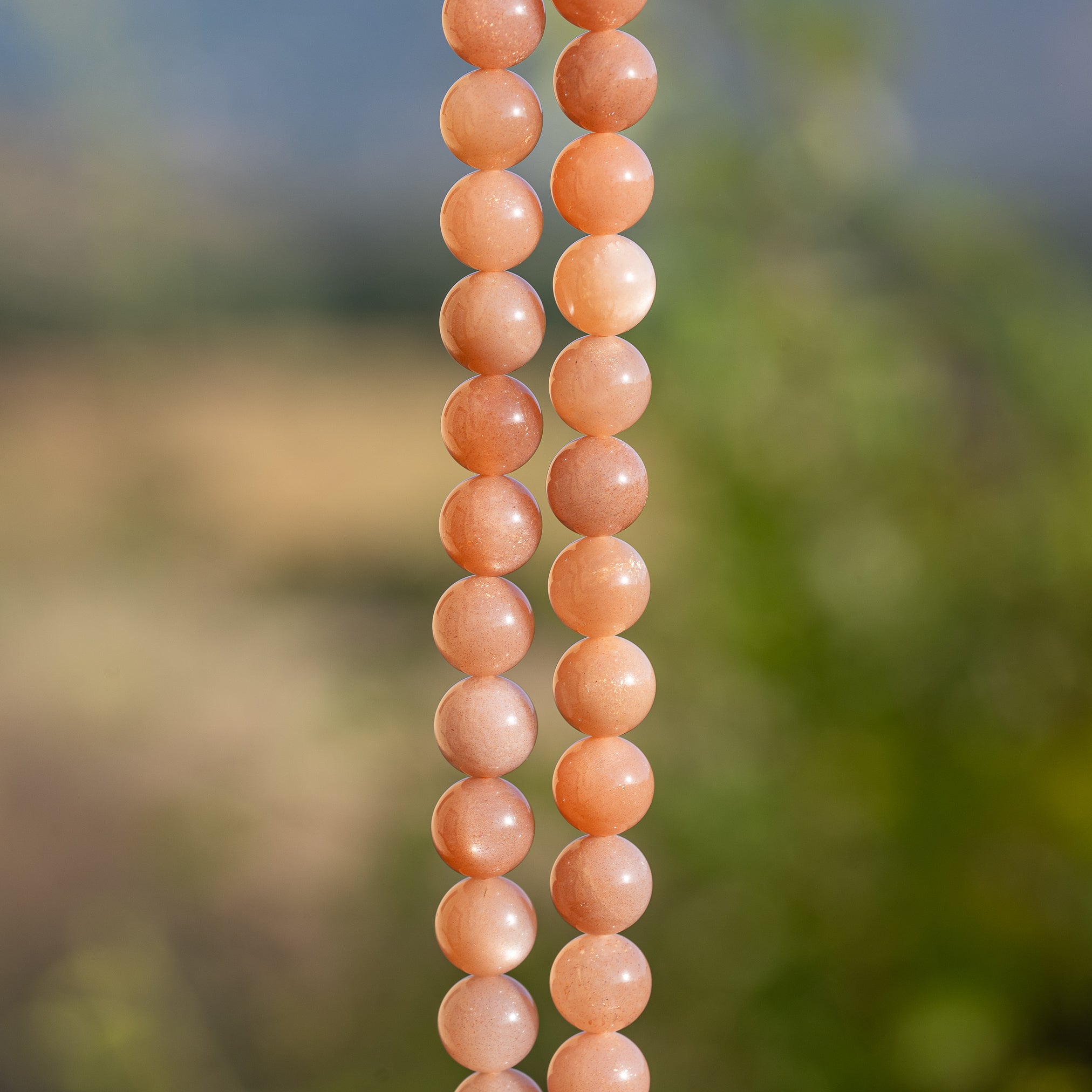 Perles rondes lisses de pierre de lune rose solaire grade A de 8,5 mm ( 1/2 rang de env 23 perles )