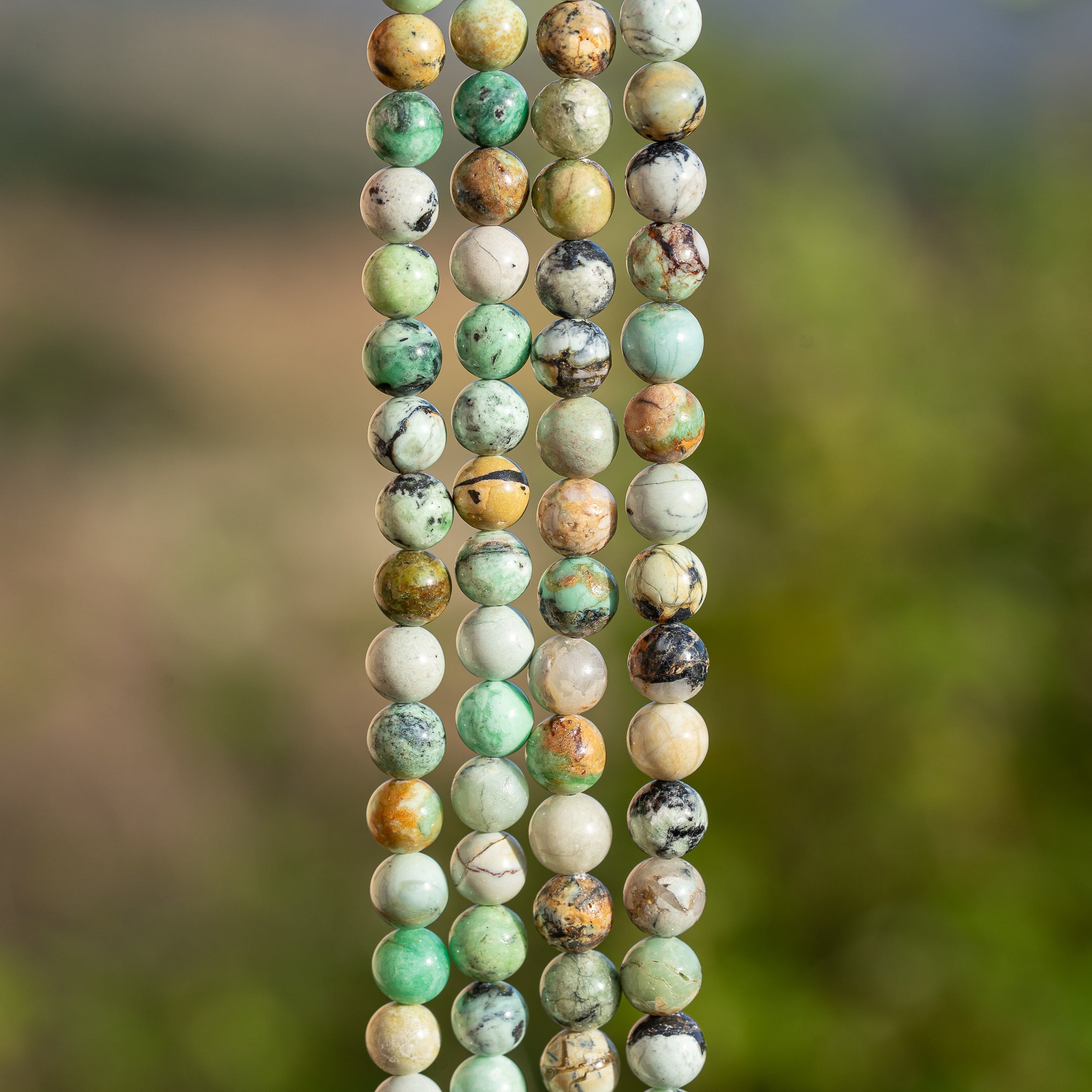 Perles rondes lisses de Variscite de 6 ou 6,5 mm ( 1/2 rang de 32/30 perles )