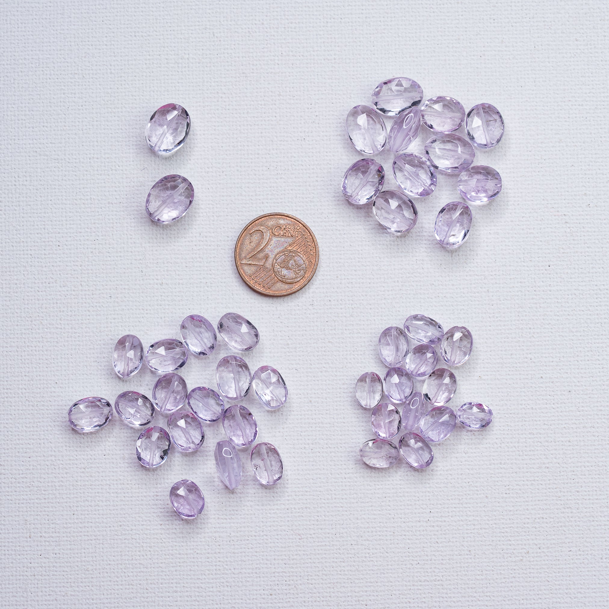Perles ovales facettes en Améthyste lilas de env 7,5 à 11,5 mm ( à l&