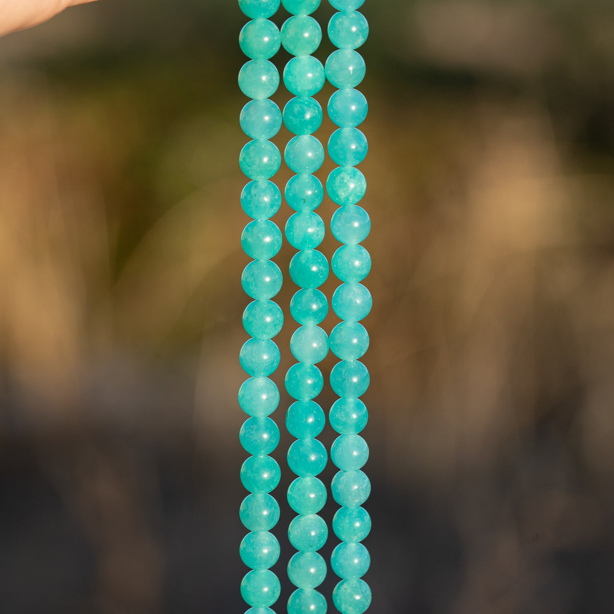 Perles rondes lisses en Amazonite du Pérou de 6,2 mm ( 1/2 rang de env 30 perles )