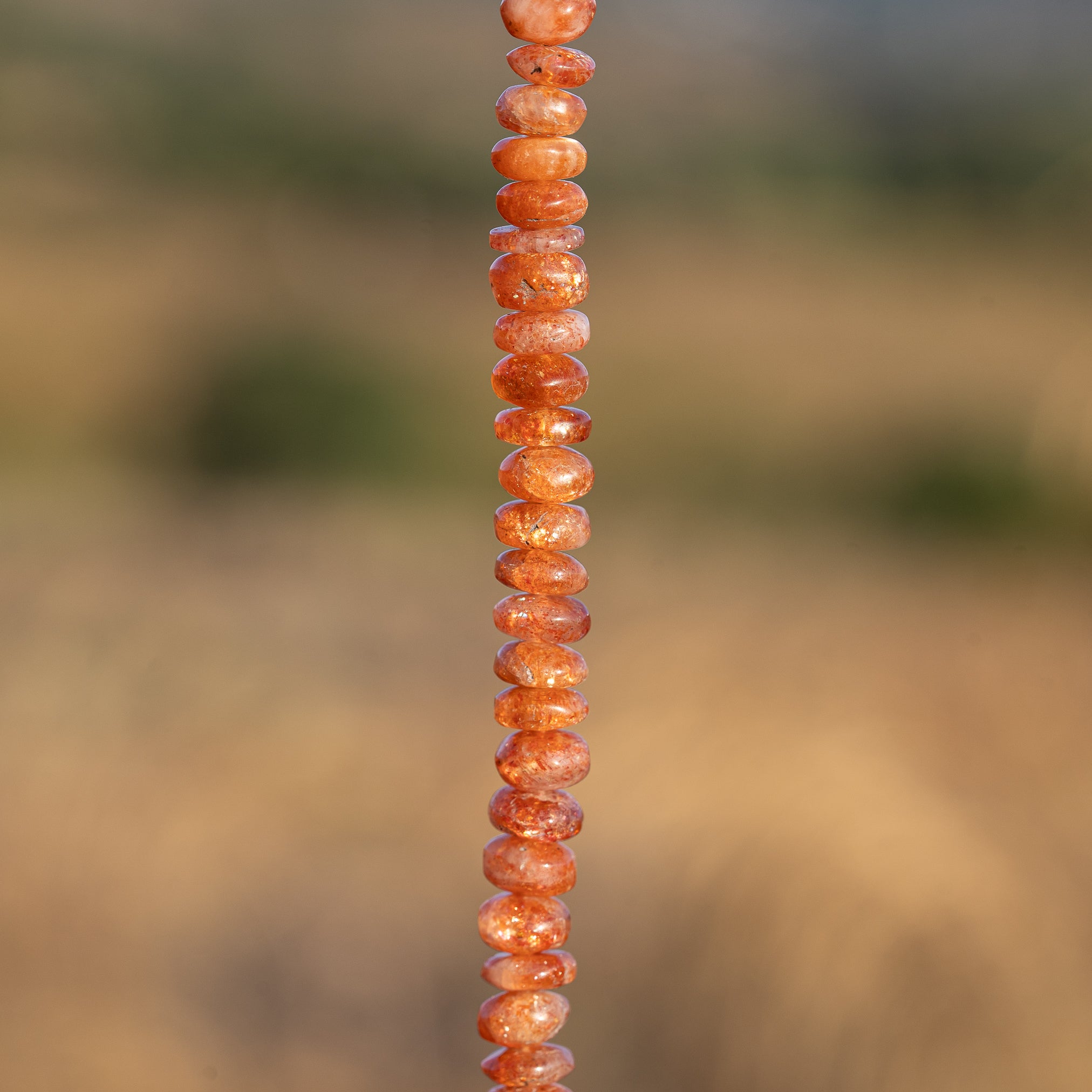 Perles rondelles lisses de Pierre de soleil de 6 à 6,5 mm au choix ( lot de 4 perles )