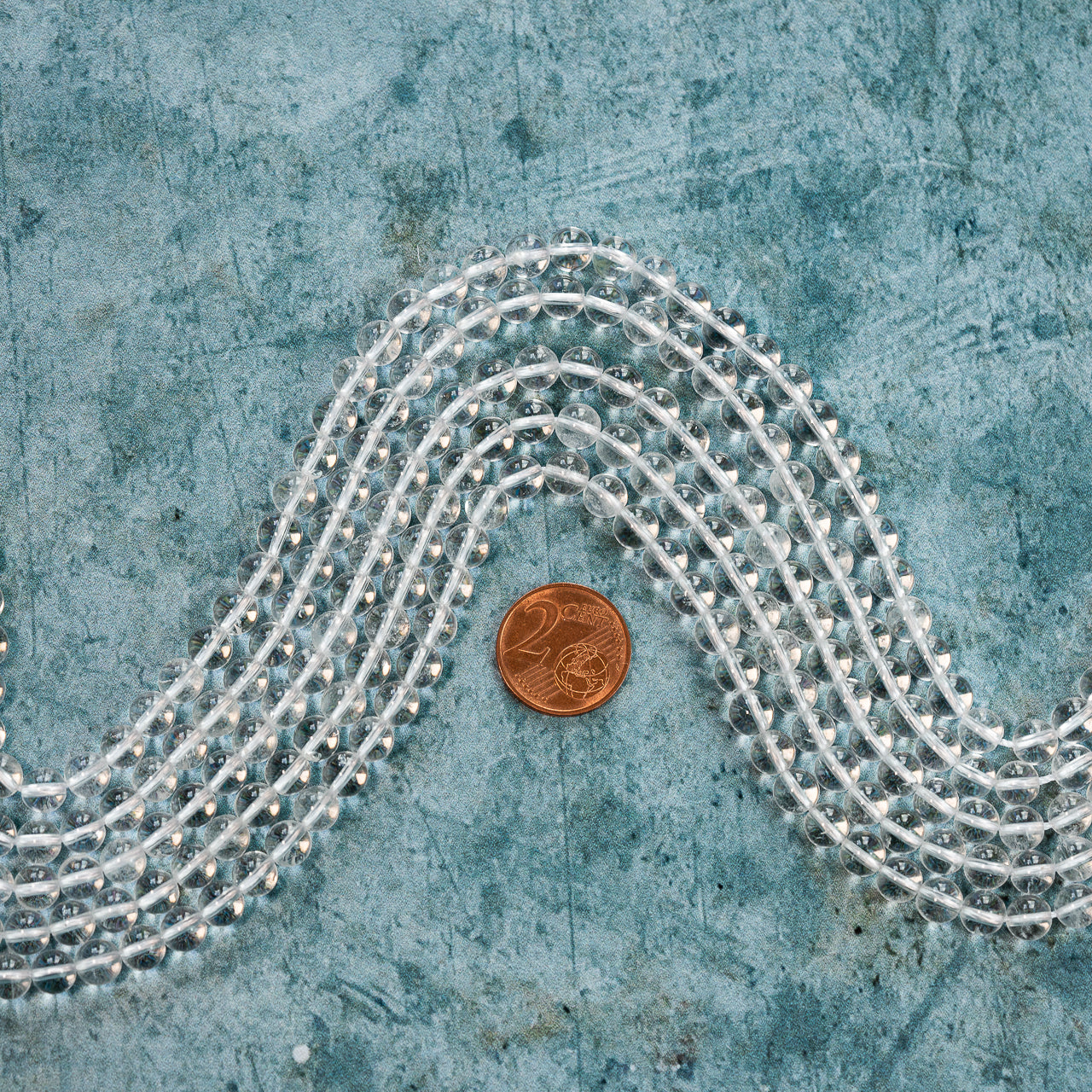 Perles rondes lisses de cristal de roche de 6 mm ( rang de env 62 perles )