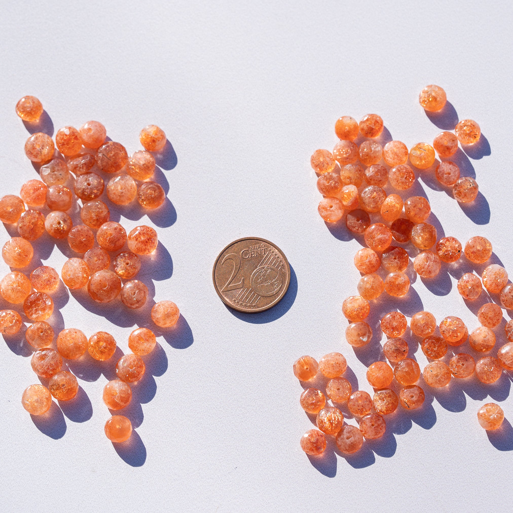 Perles rondelles facettes de Pierre de soleil de 6 à 7,5 mm au choix ( lot de 4 perles )