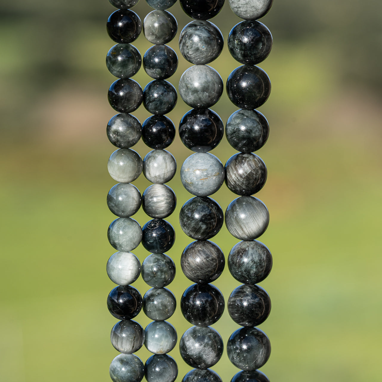 Perles rondes lisses en Oeil de faucon grade a de 8 ou 10 mm ( 1/2 rang )